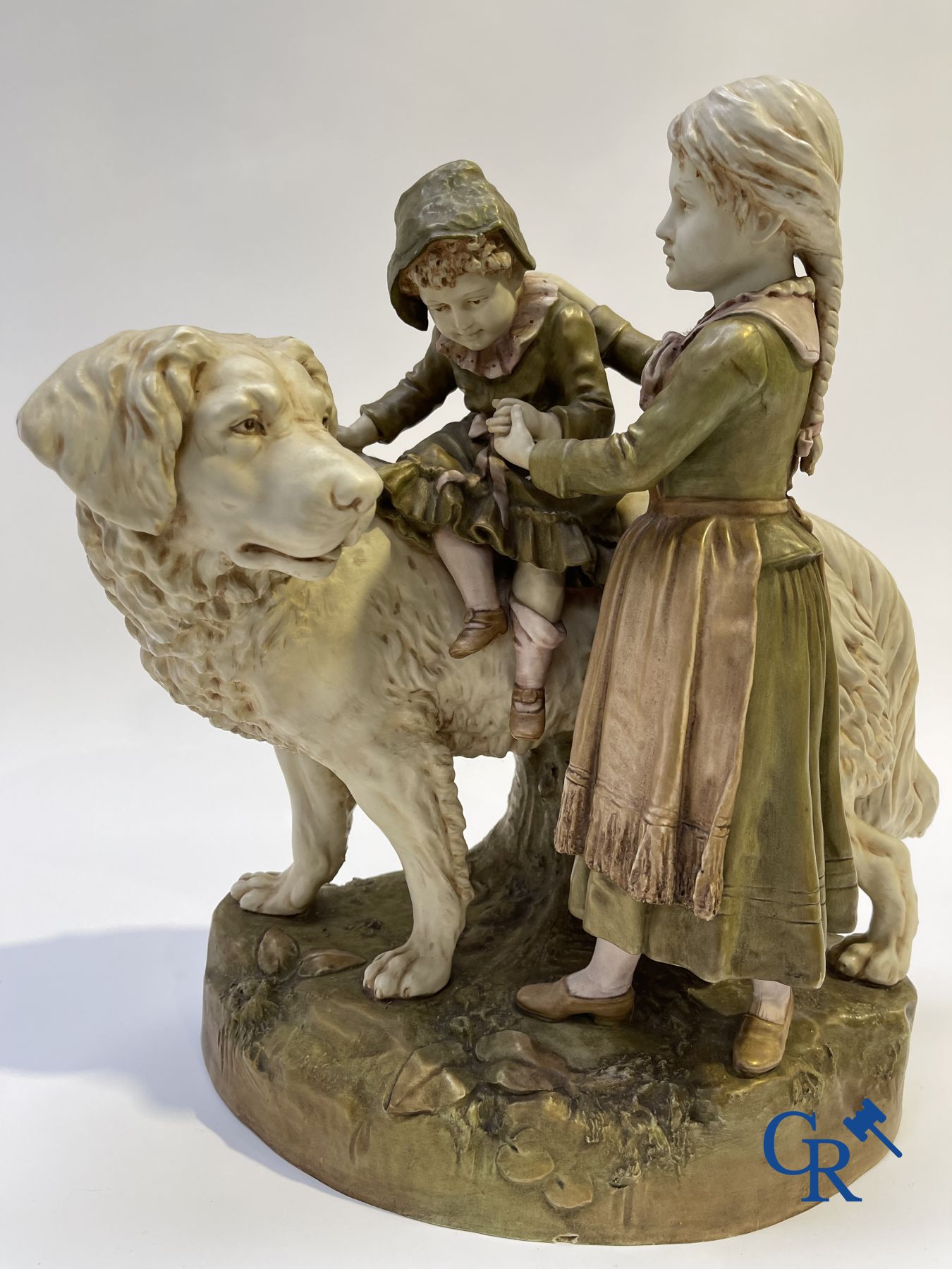 Porcelain: Royal Dux. A polychrome representation of a Saint Bernard dog with children.