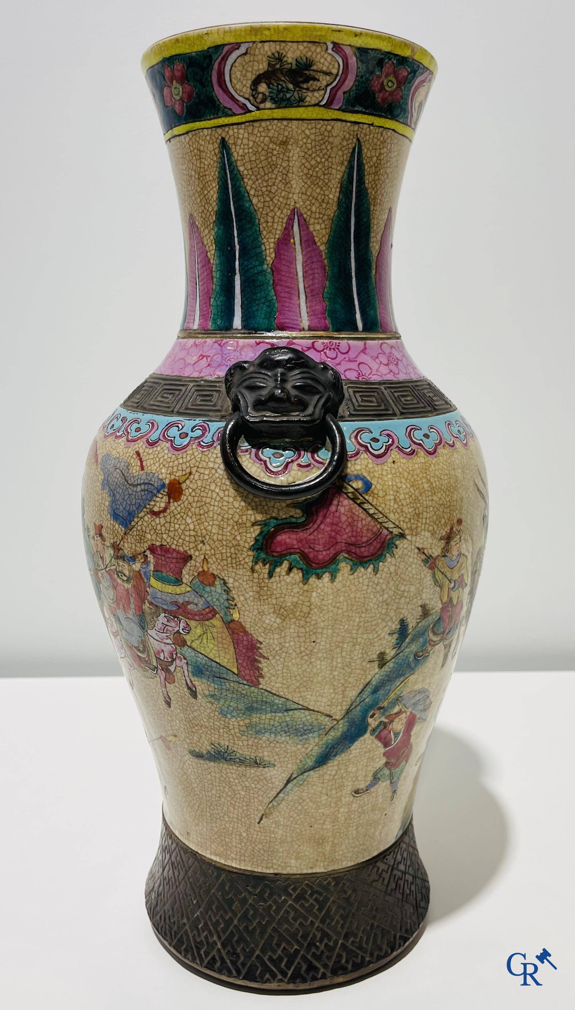 Asian art: A Chinese Nanking famille rose crackle vase with warrior decor. 19th century.