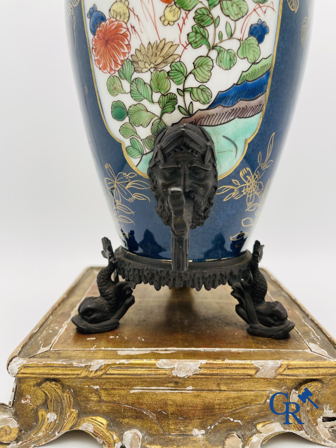 A porcelain table fountain with bronze fittings.