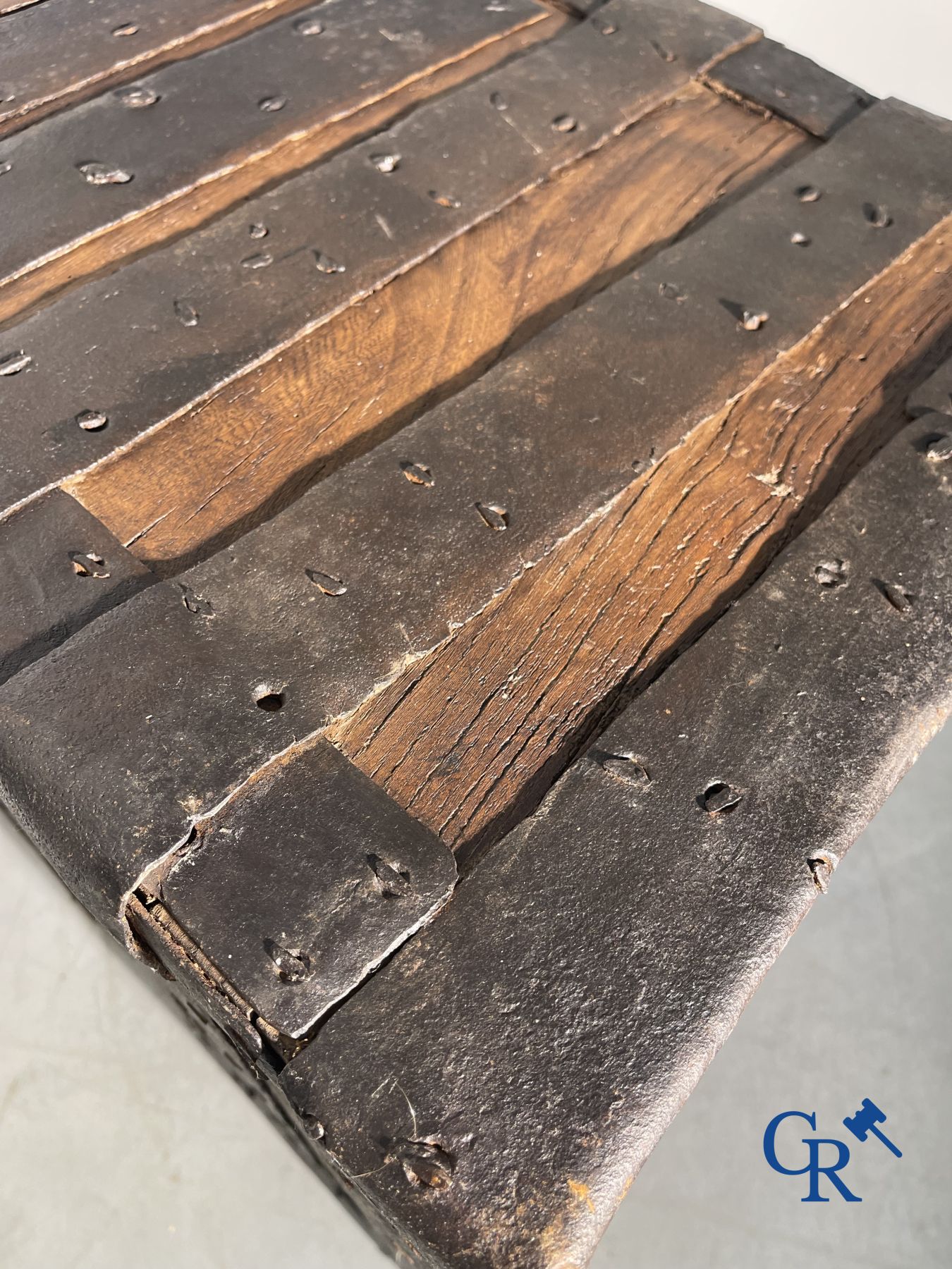 Antique wooden chest with hardware and lockwork in forging.