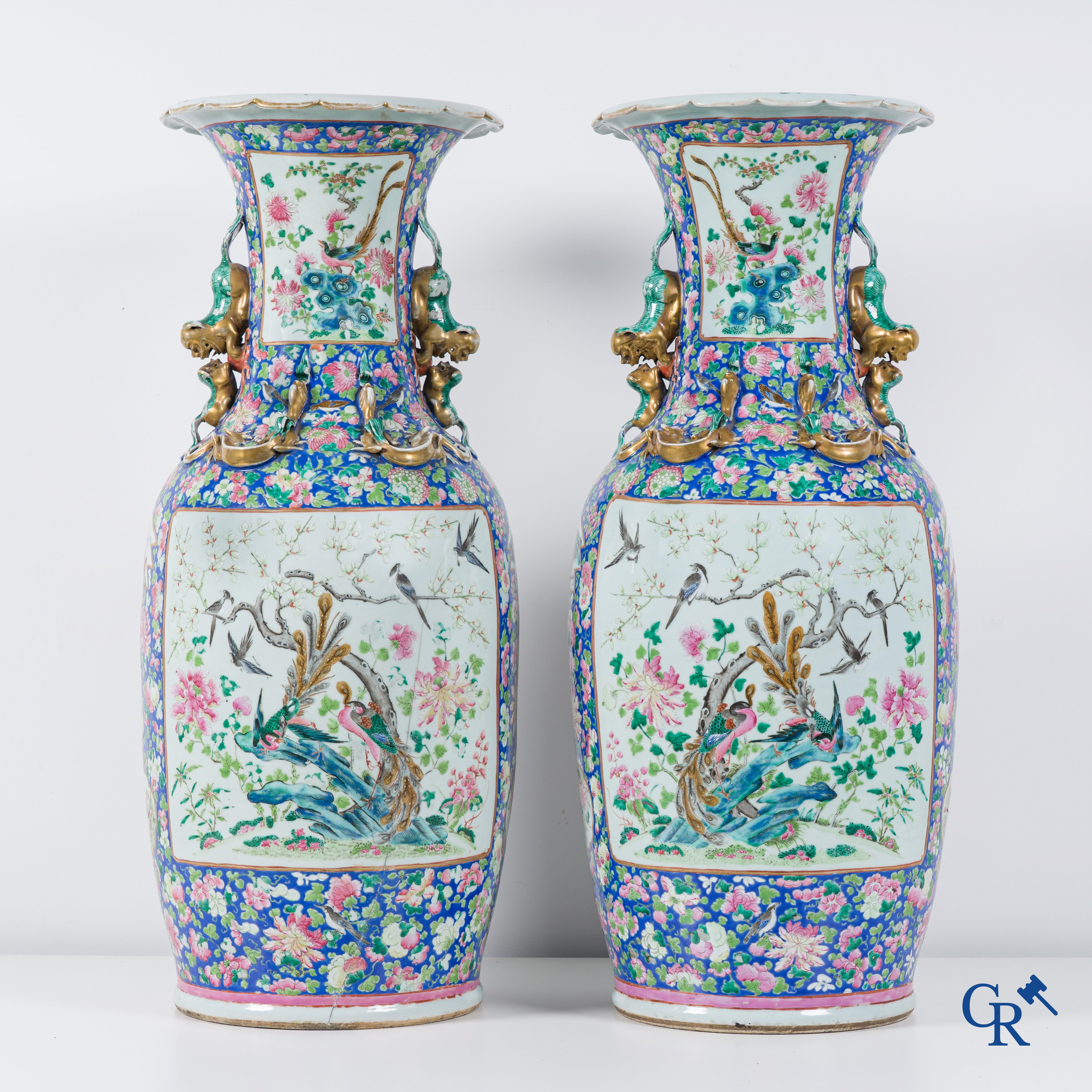 Asian Art: Chinese porcelain. A pair of imposing Chinese vases with famille rose decor. China 19th century.