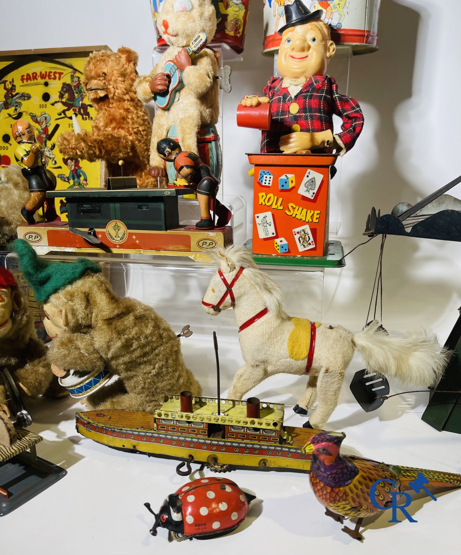 Toys: Large lot mechanical and tin toys.