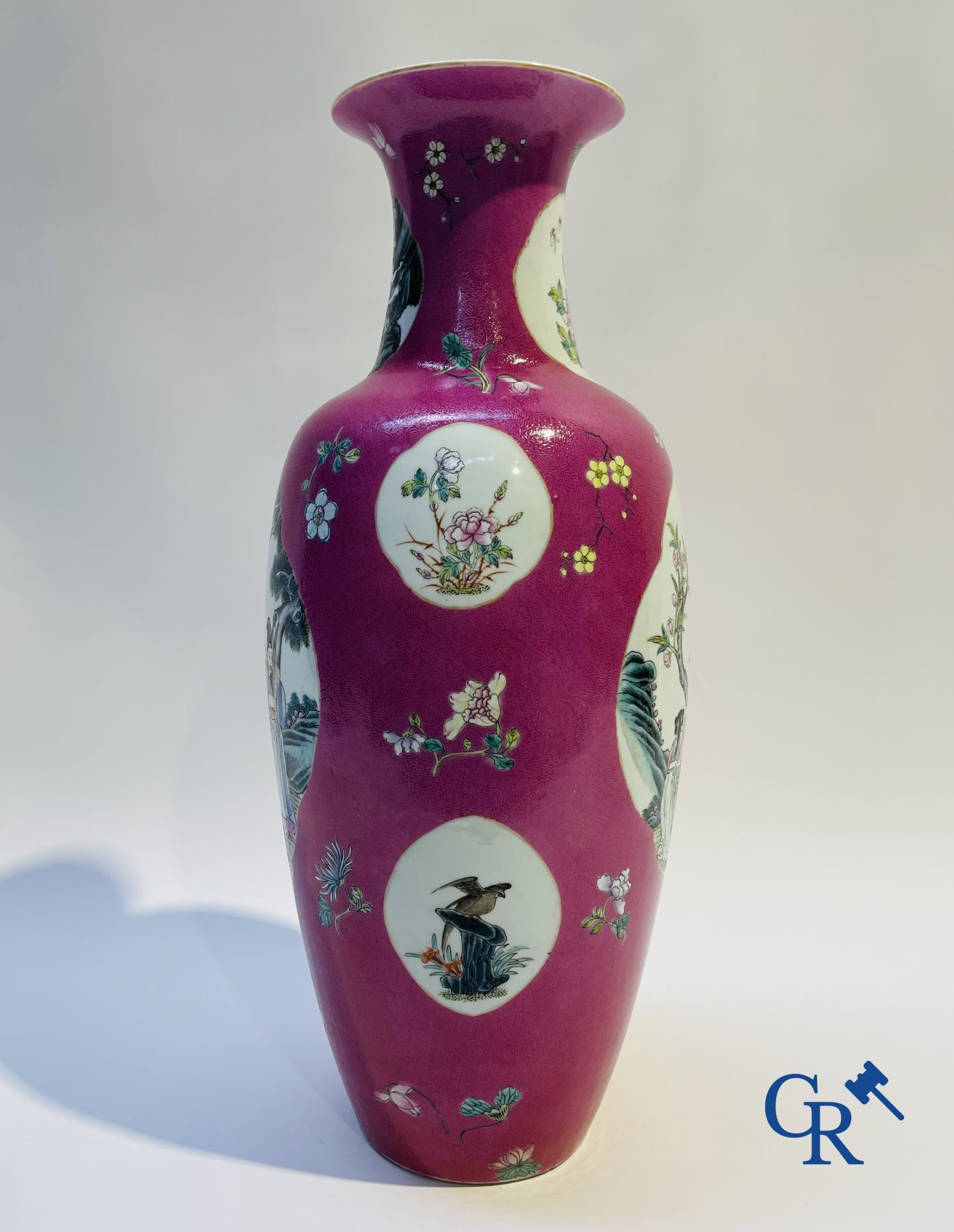 Chinese porcelain: A fine famille rose vase decorated on a red ruby background in sgraffito technique.