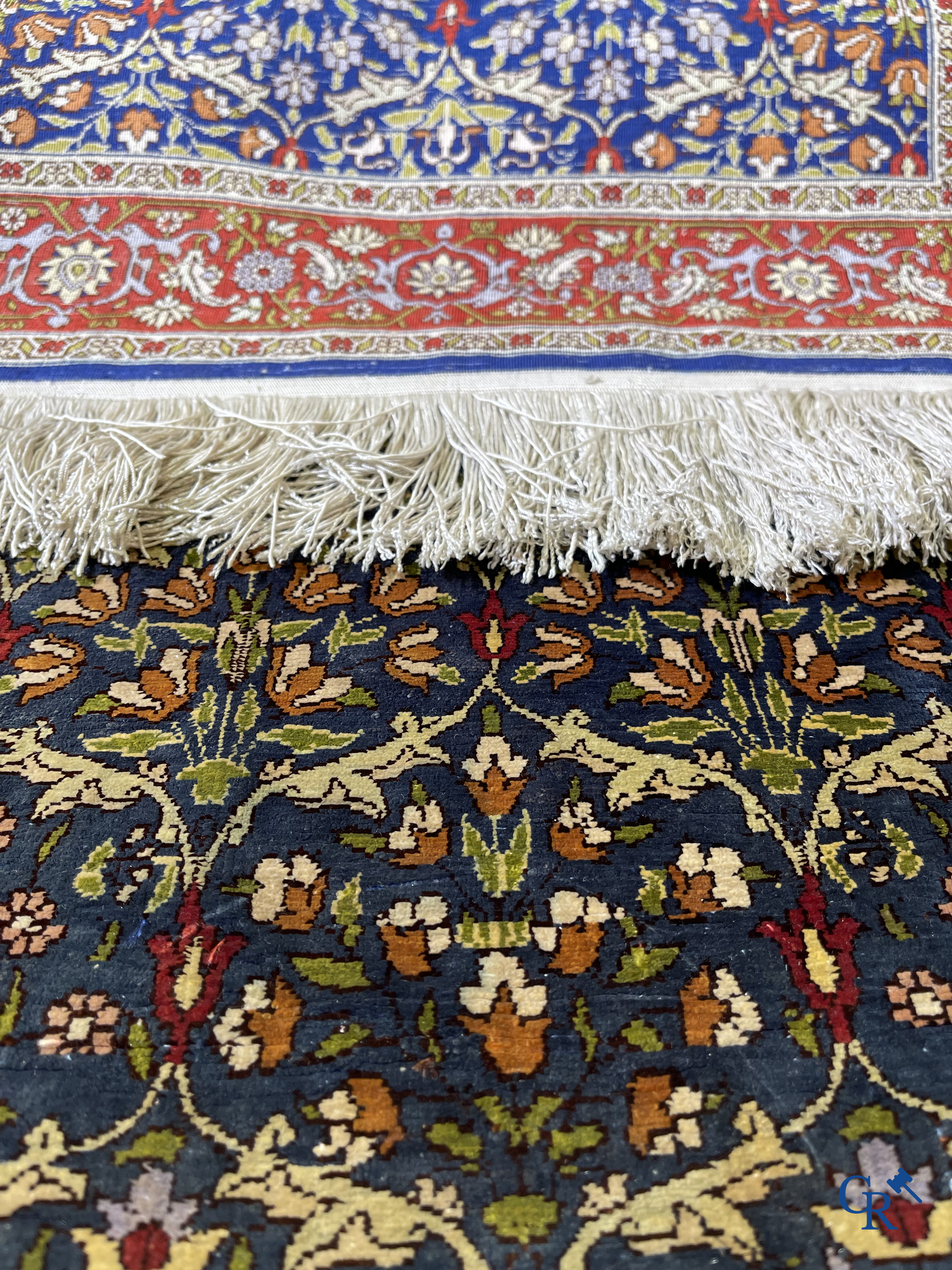 Oriental carpets, a finely hand-knotted silk carpet with floral decor.