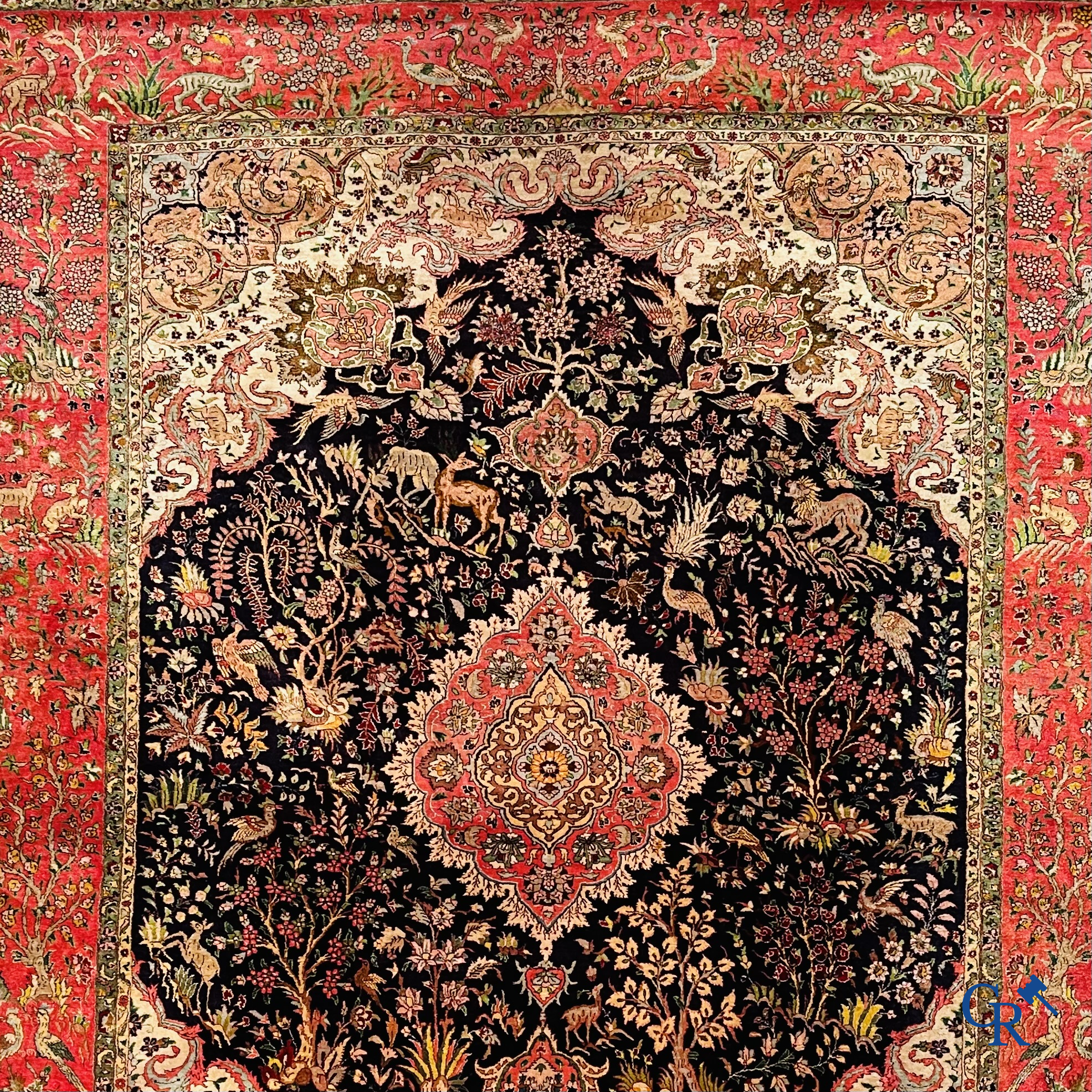 Oriental carpets: Tabriz, a finely hand-knotted silk carpet with forest animals and birds in a floral decor.