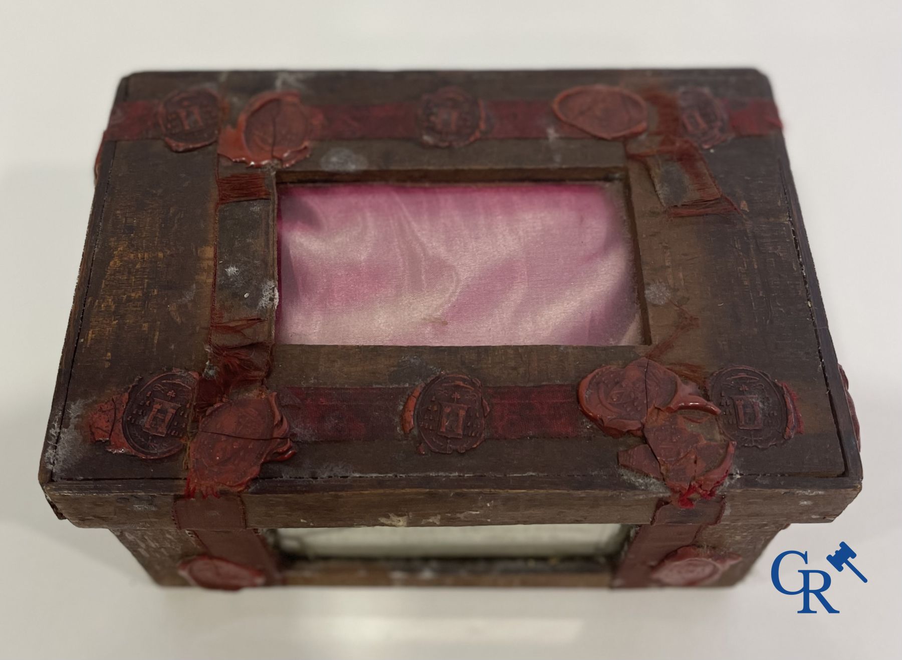 An antique wooden reliquary sealed with wax seals. Early 19th century.