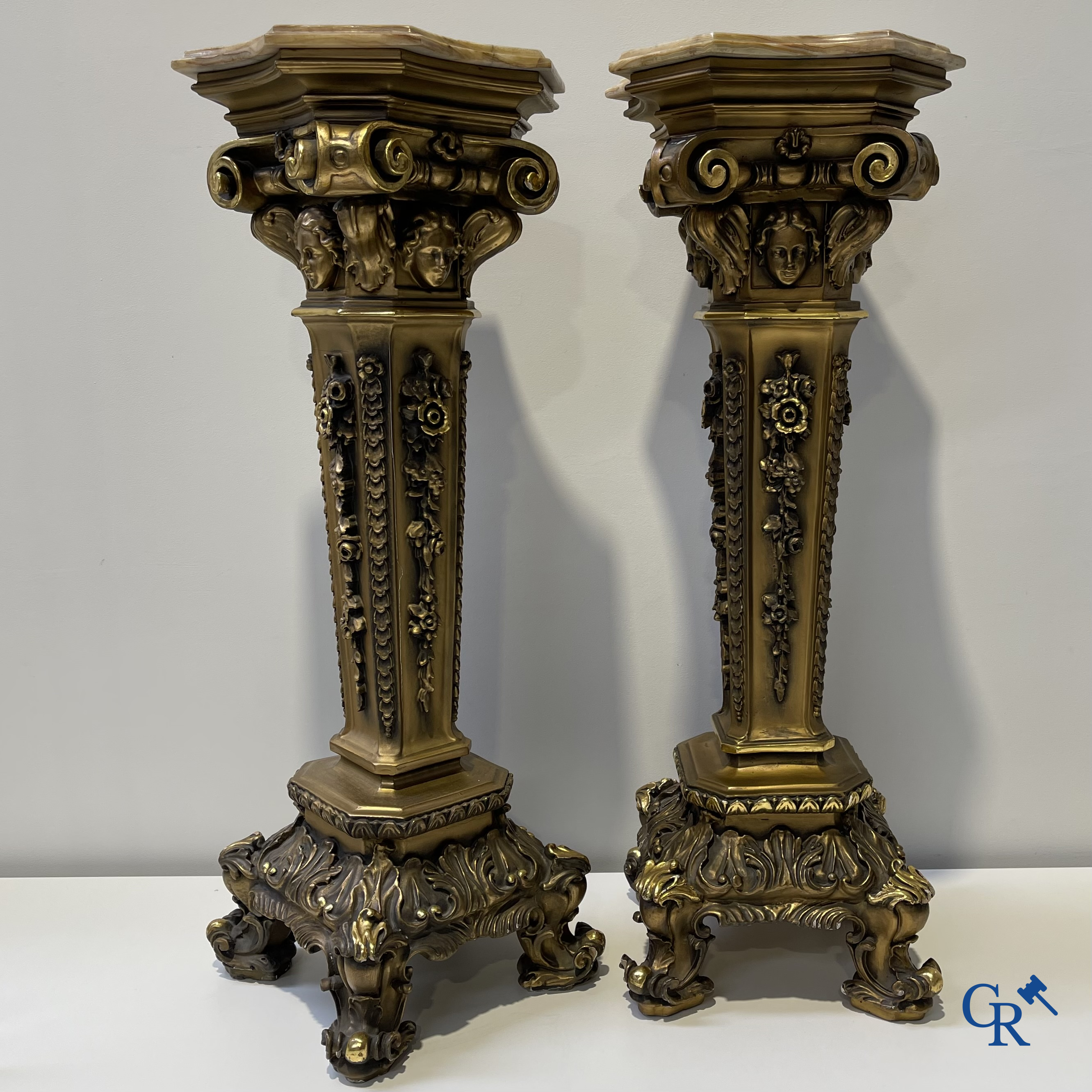 Pair of decorative gilded pedestals with onix top.