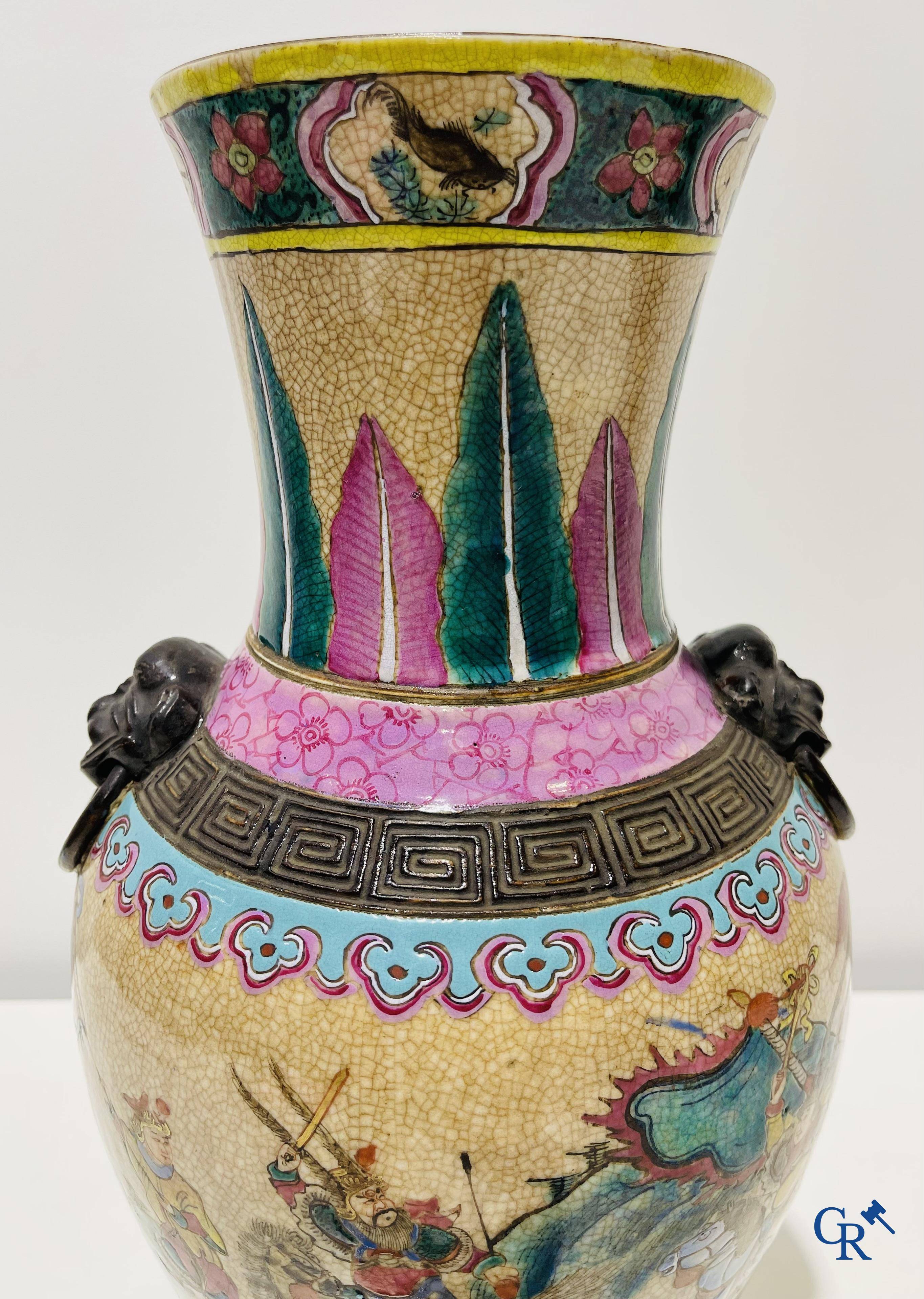 Asian art: A Chinese Nanking famille rose crackle vase with warrior decor. 19th century.