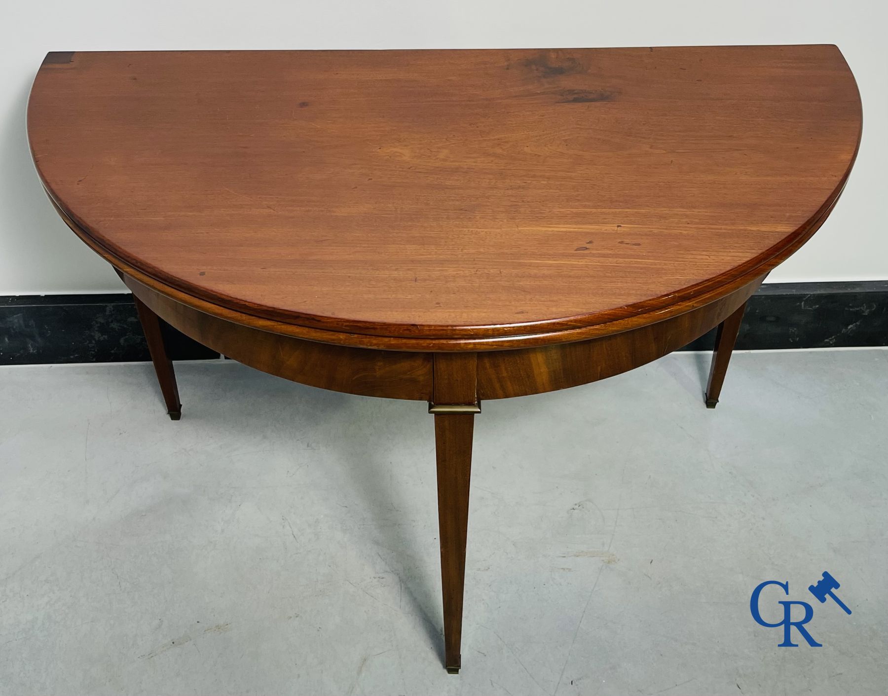 Furniture: fold-out crescent-shaped mahogany table. Directoire period.