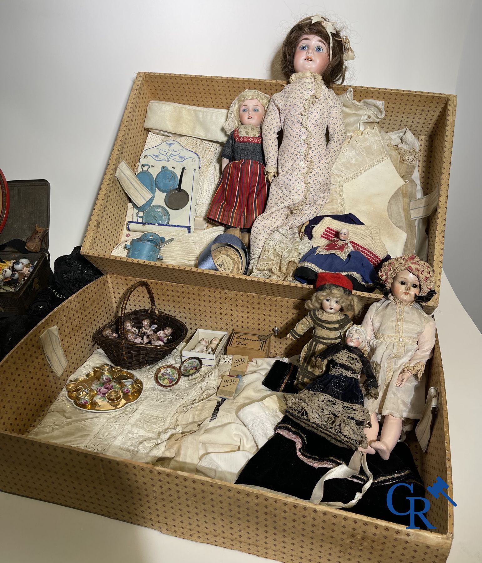 Toys: Travel case filled with various dolls and collectibles.