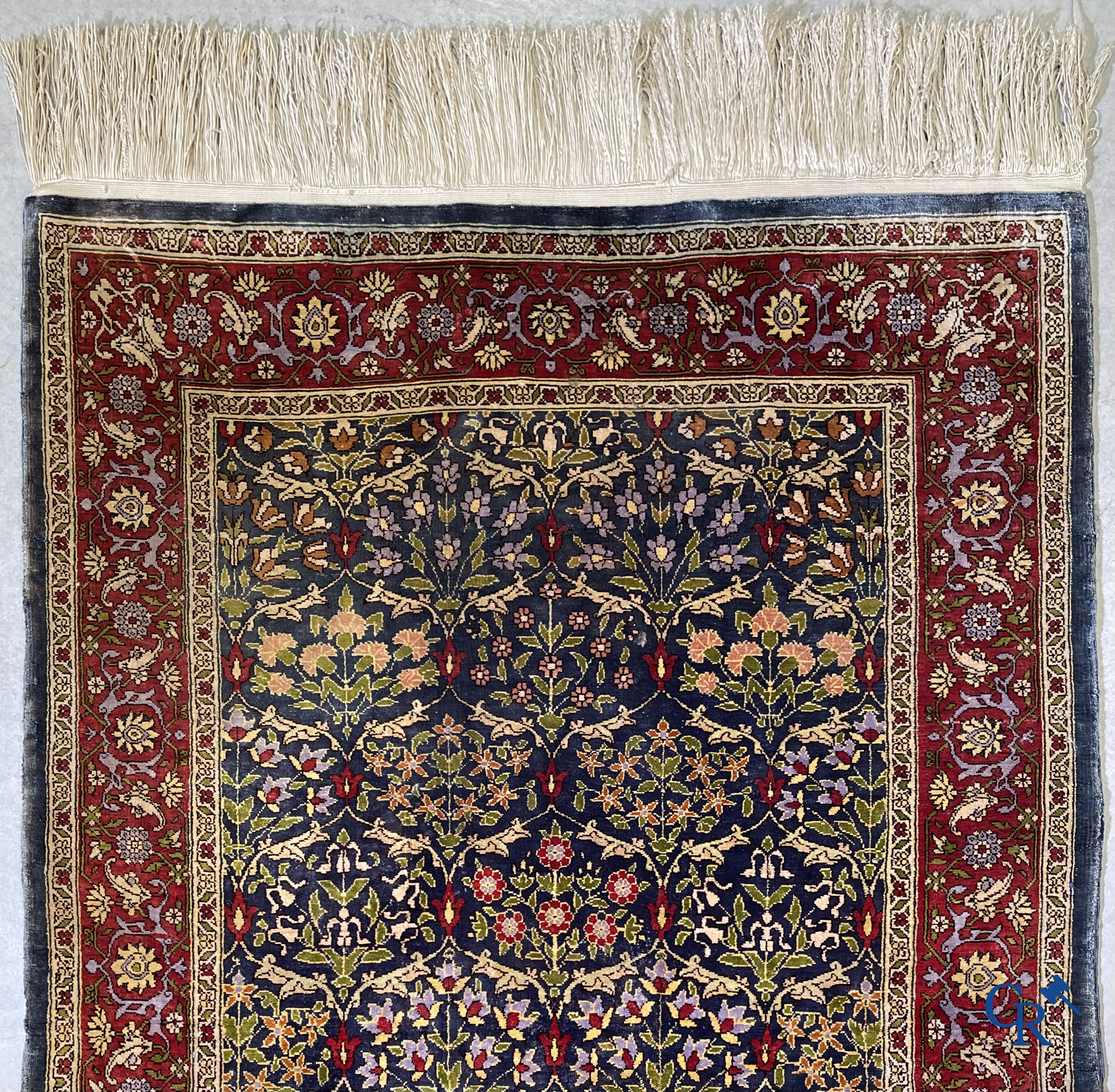 Oriental carpets, a finely hand-knotted silk carpet with floral decor.