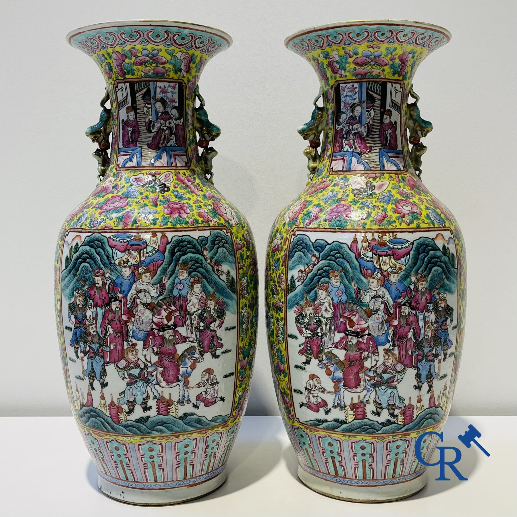 Asian art: A pair of Chinese famille rose vases with yellow background with court scenes. 19th century.