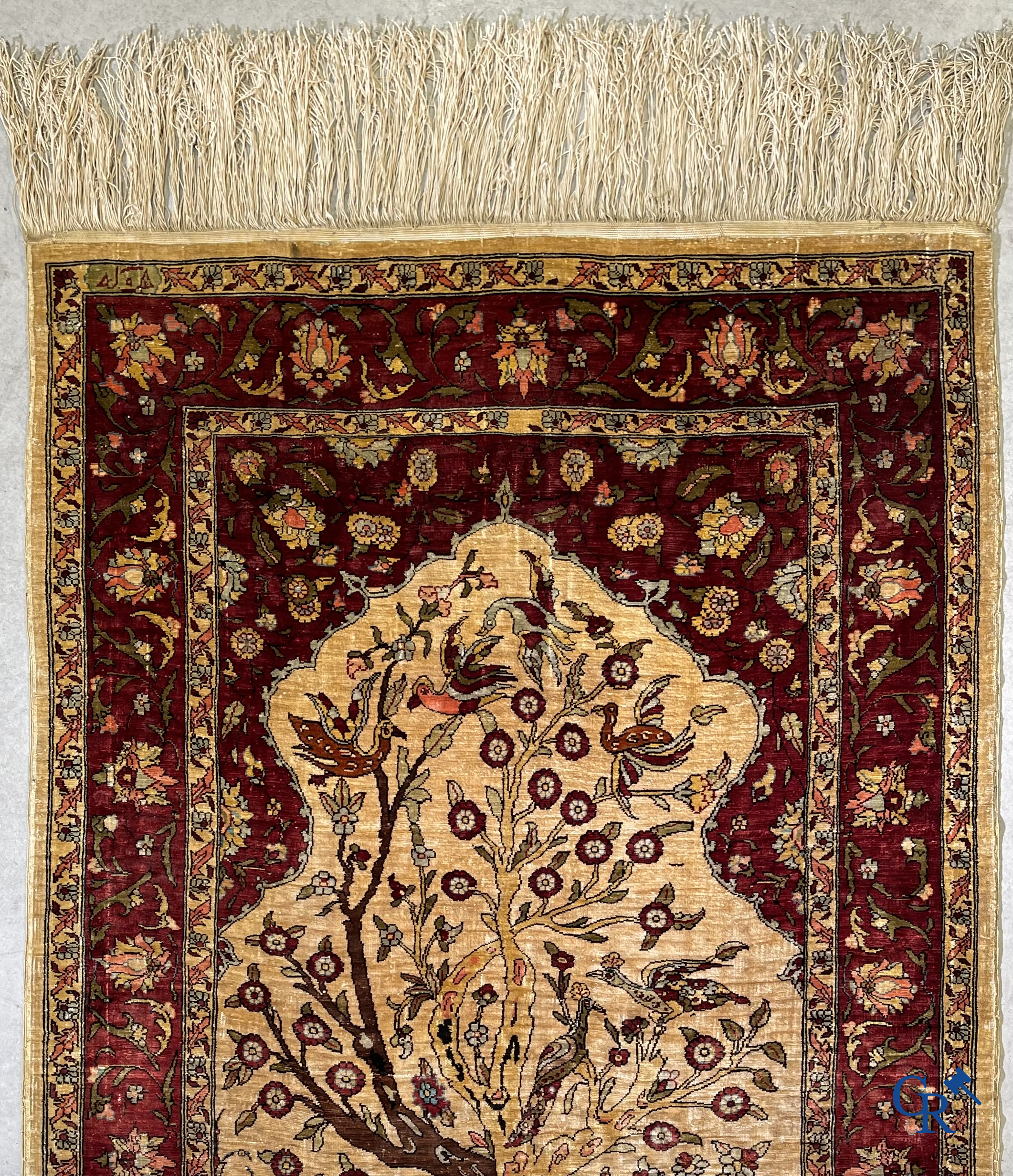 Oriental carpets, Hereke, a finely hand-knotted and signed silk carpet with a tree of life.