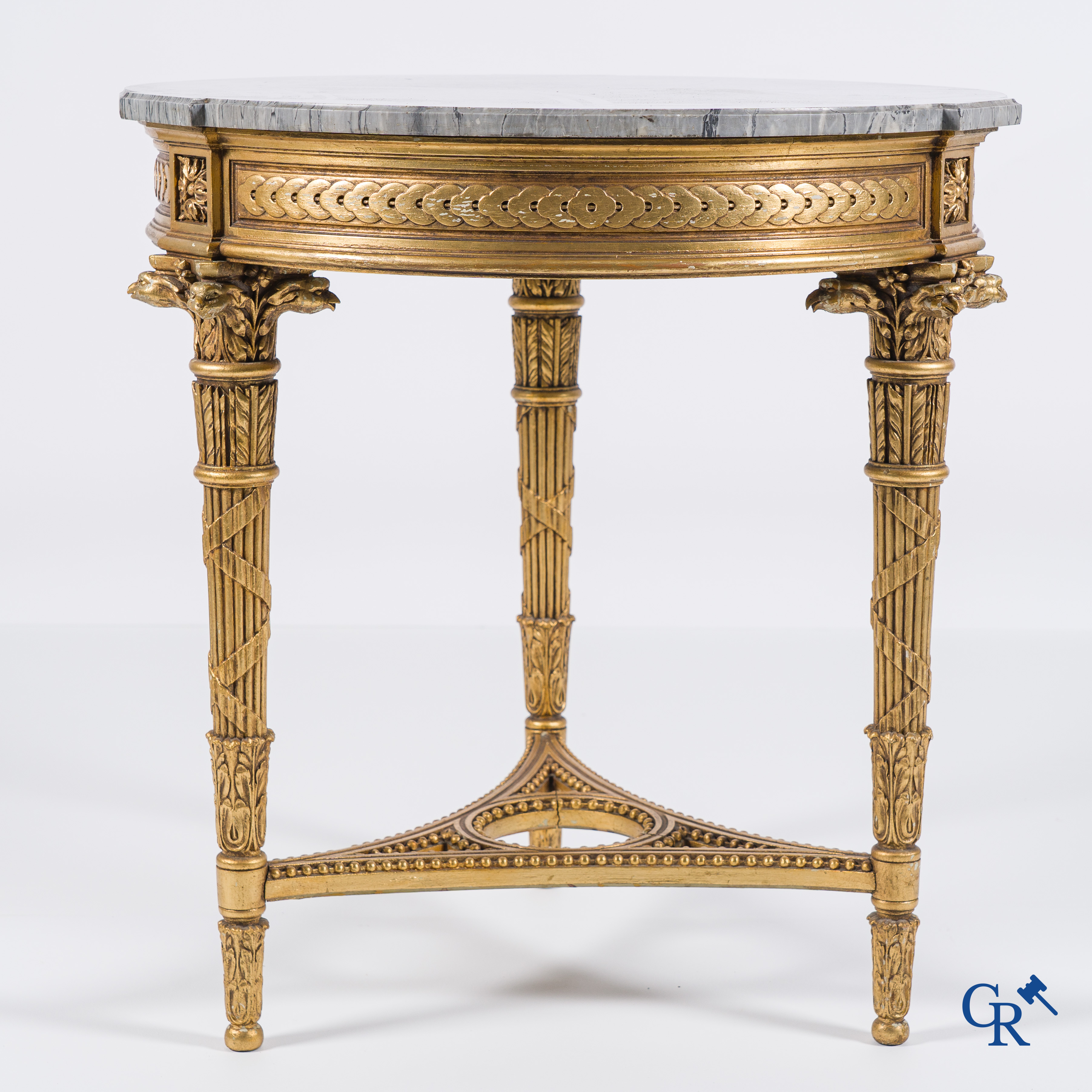 A wood-carved and gilded LXVI-style coffee table with a marble top in St. Anna marble.