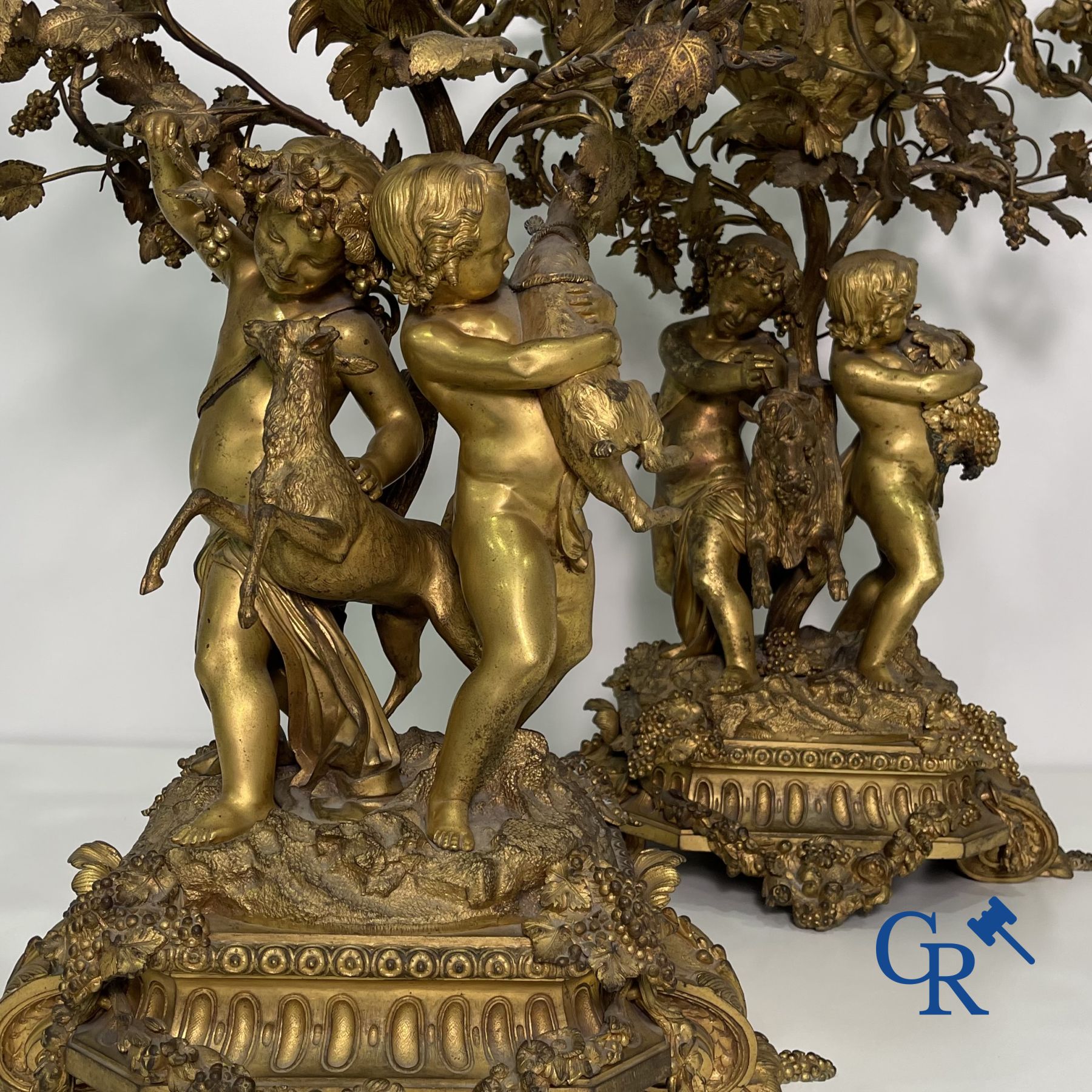 A pair of imposing bronze candlesticks with putti in LXVI style. Napoleon III period.