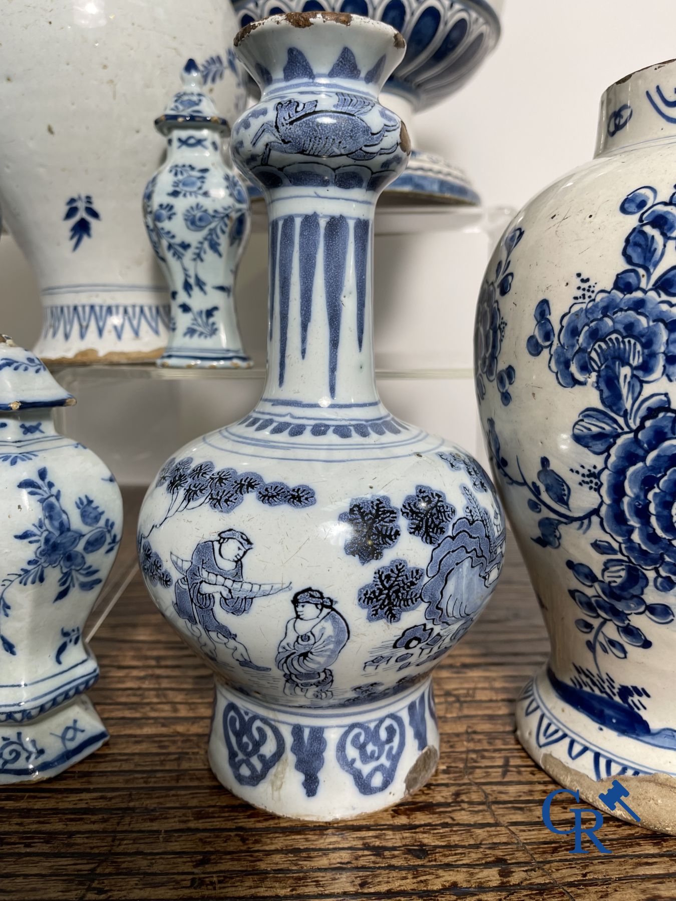 Delft: 11 pieces of blue and white faience with different décors. 17th - 18th century.