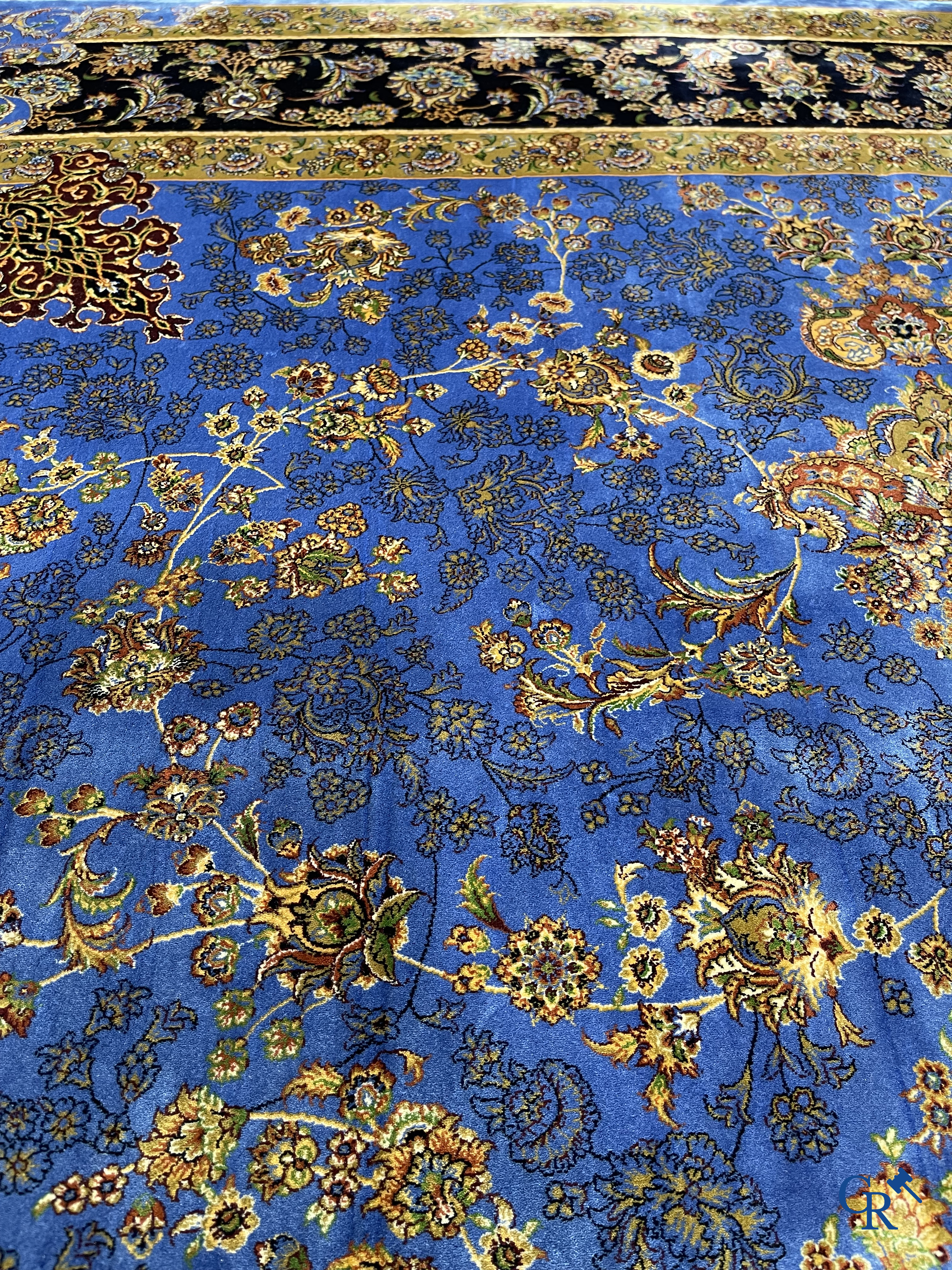 Carpets. Exceptional silk carpet with floral decor on a blue background.