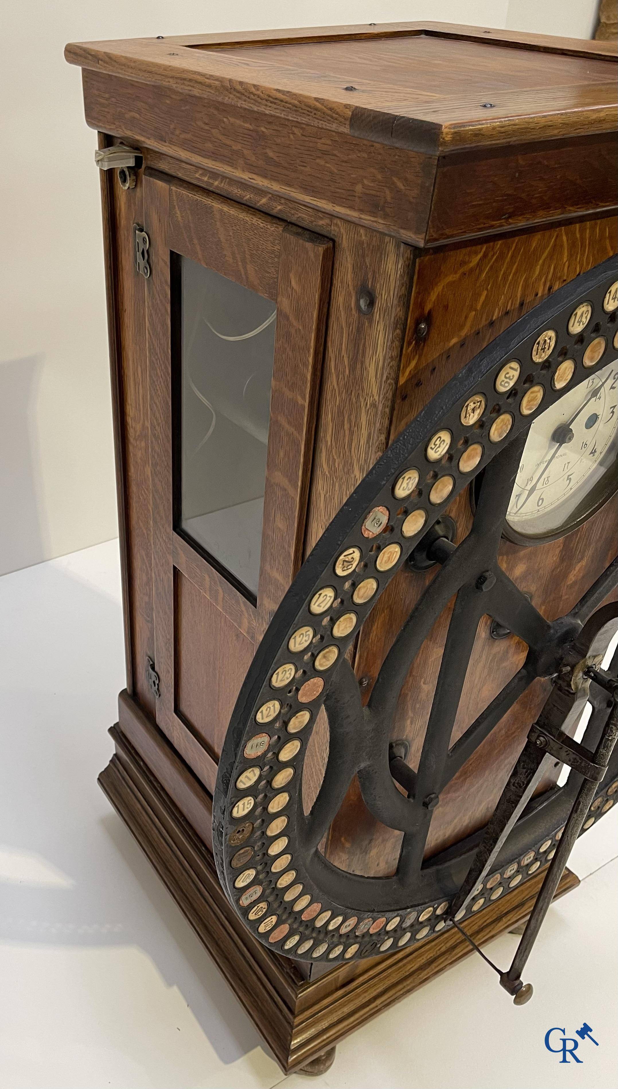 "International" Watson Business Machines Corporation of Belgium. A time clock with cast iron wheel. Circa 1900.