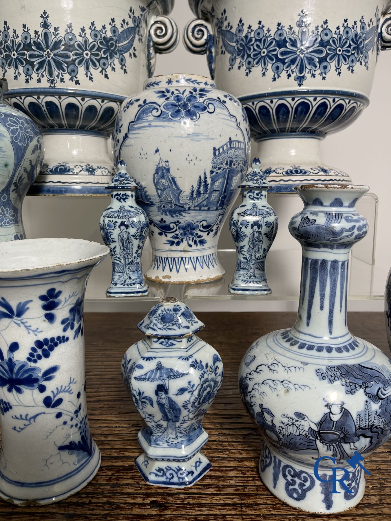 Delft: 11 pieces of blue and white faience with different décors. 17th - 18th century.