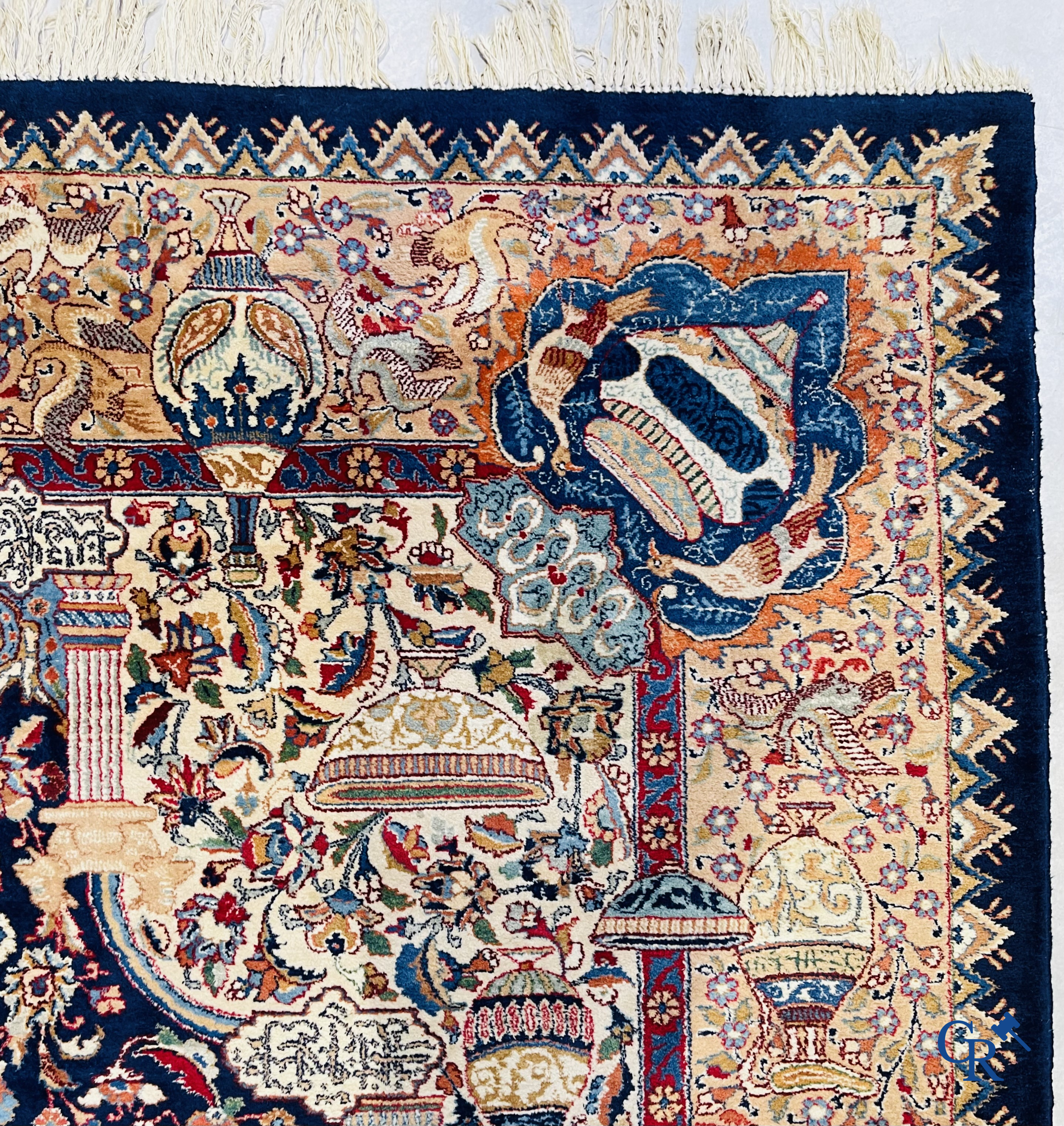 Oriental carpets: A large hand-knotted oriental carpet with antique decor. Multiple inscriptions.