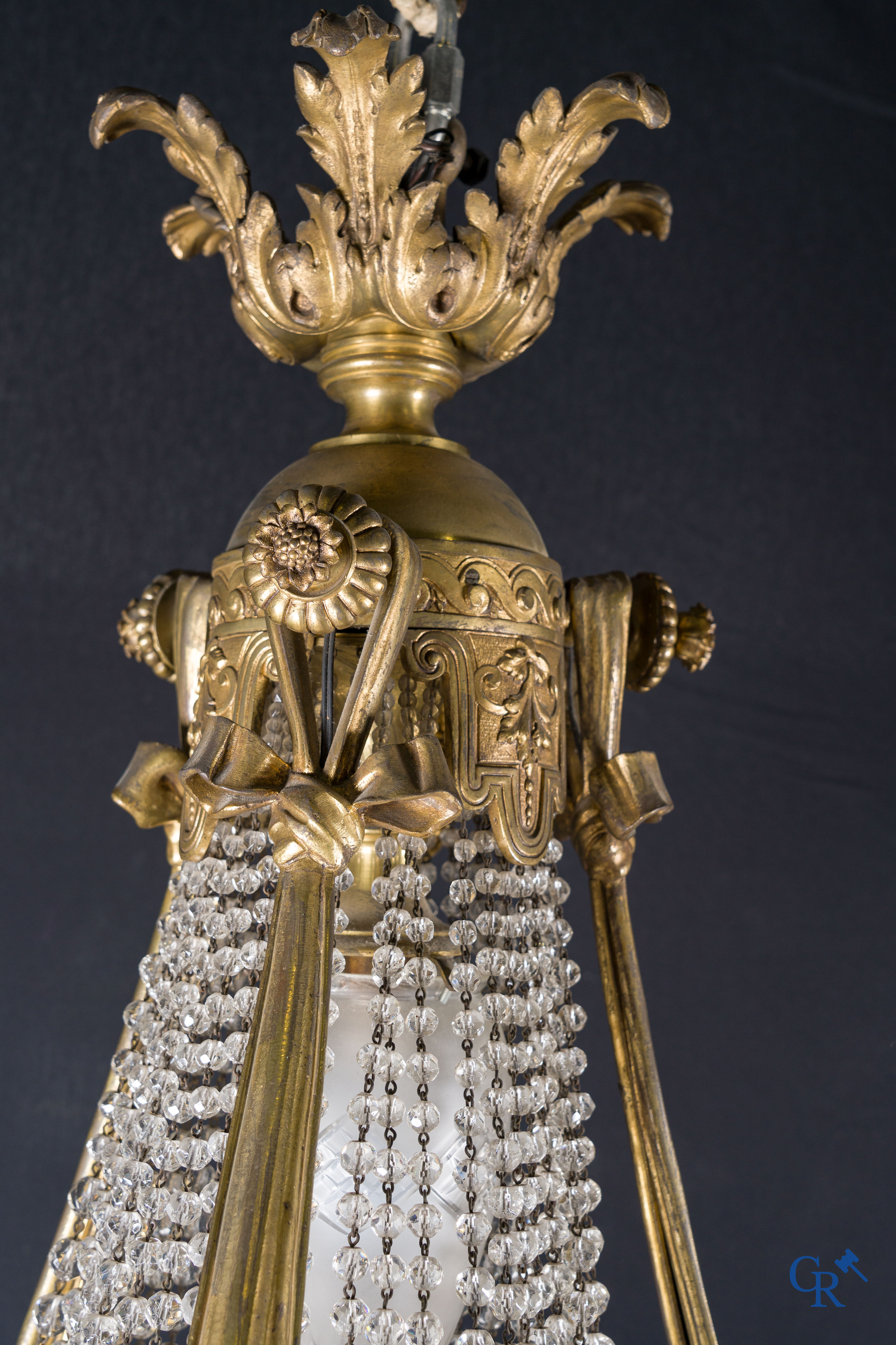 An imposing bronze and crystal chandelier in LXVI style. Circa 1920.