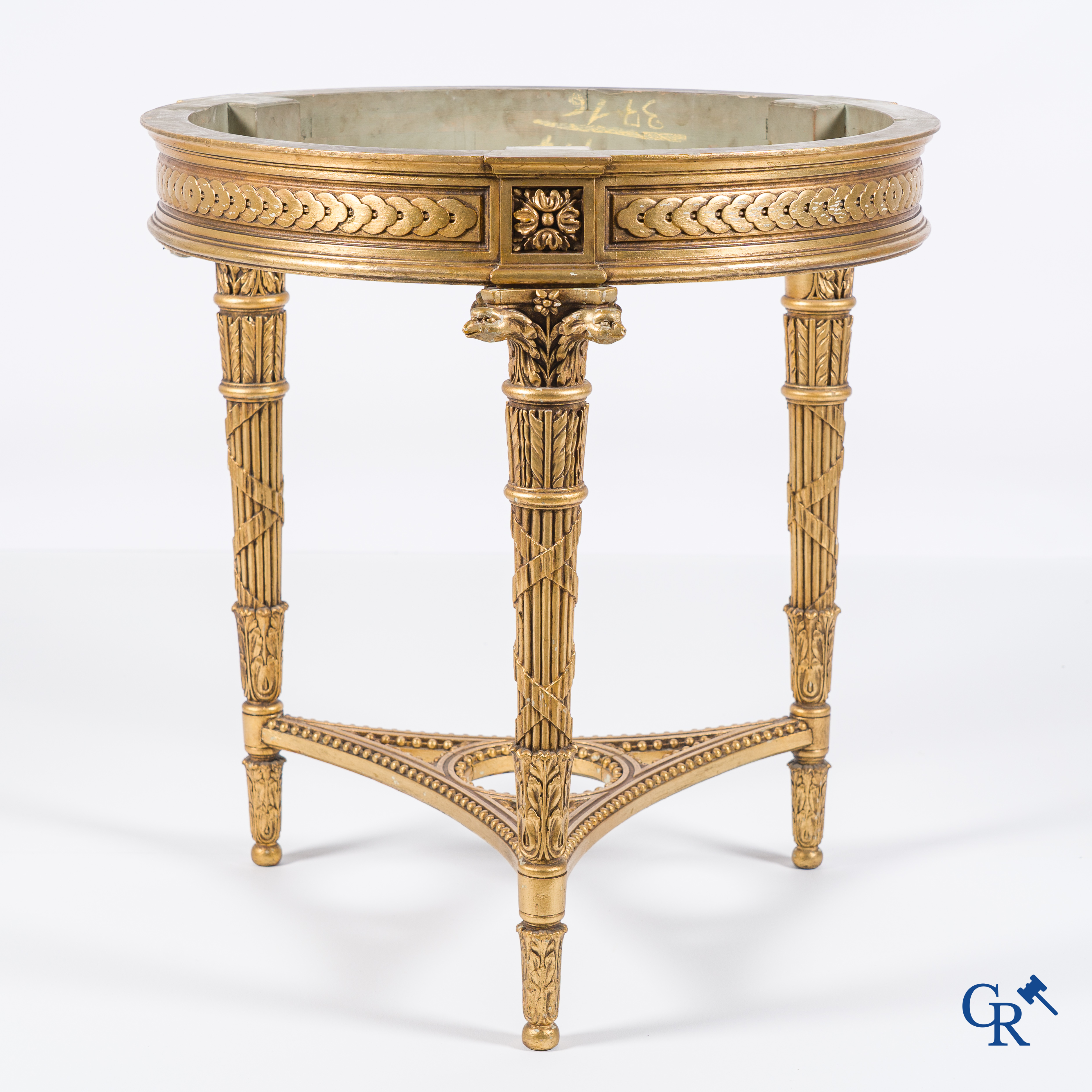 A wood-carved and gilded LXVI-style coffee table with a marble top in St. Anna marble.