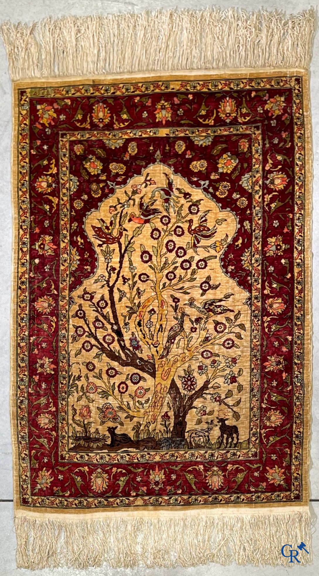 Oriental carpets, Hereke, a finely hand-knotted and signed silk carpet with a tree of life.