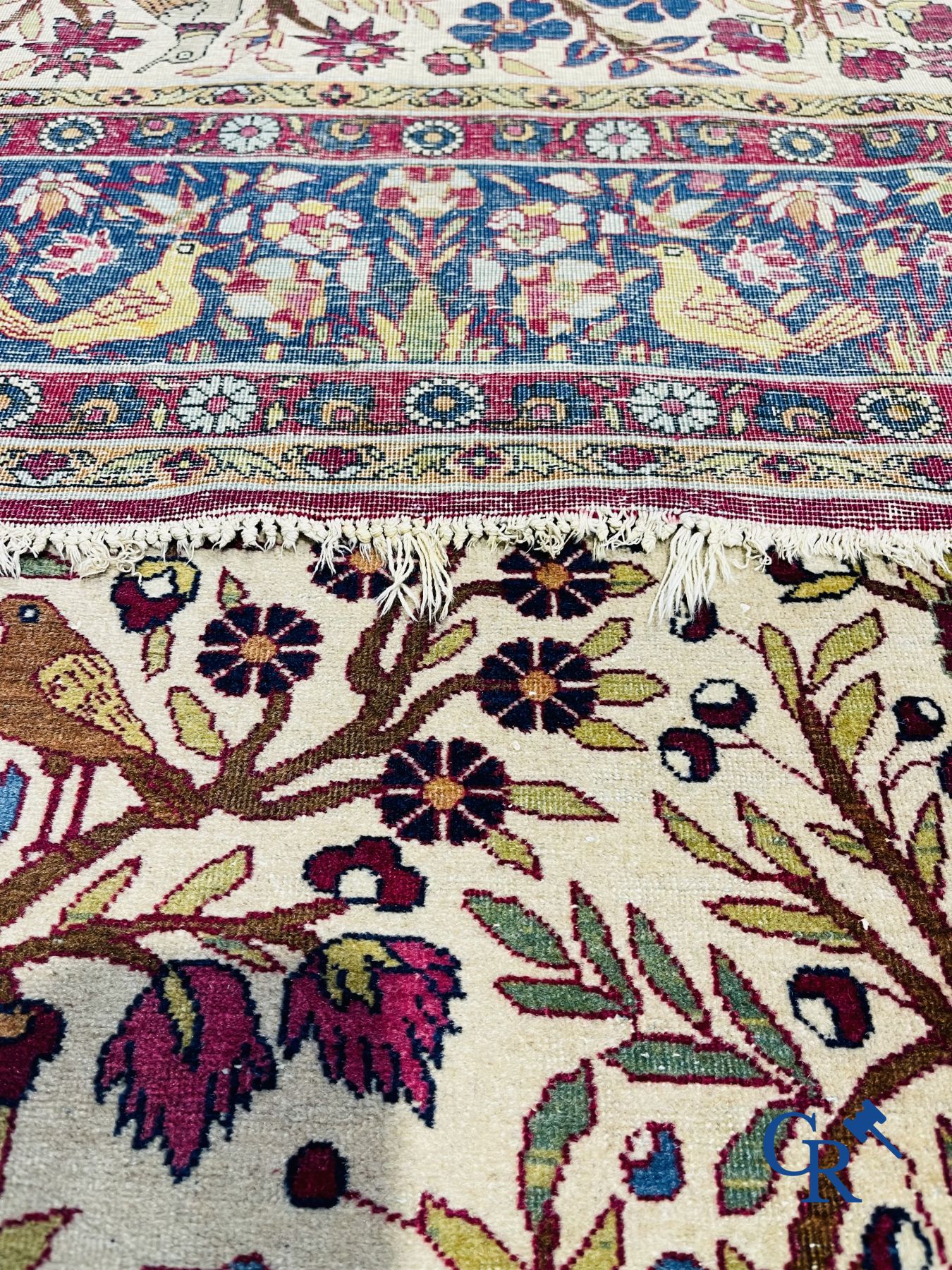 Oriental carpets: Antique oriental carpet with a decor of animals and birds in the forest.