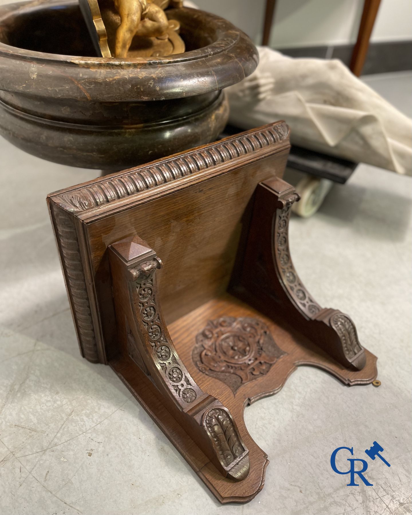 Clock with multiple bells and music in oak sculpted case with matching pedestal.