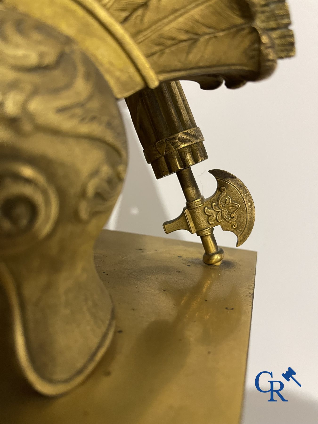 Imposing fire-gilded empire pendulum depicting a seated Roman emperor.