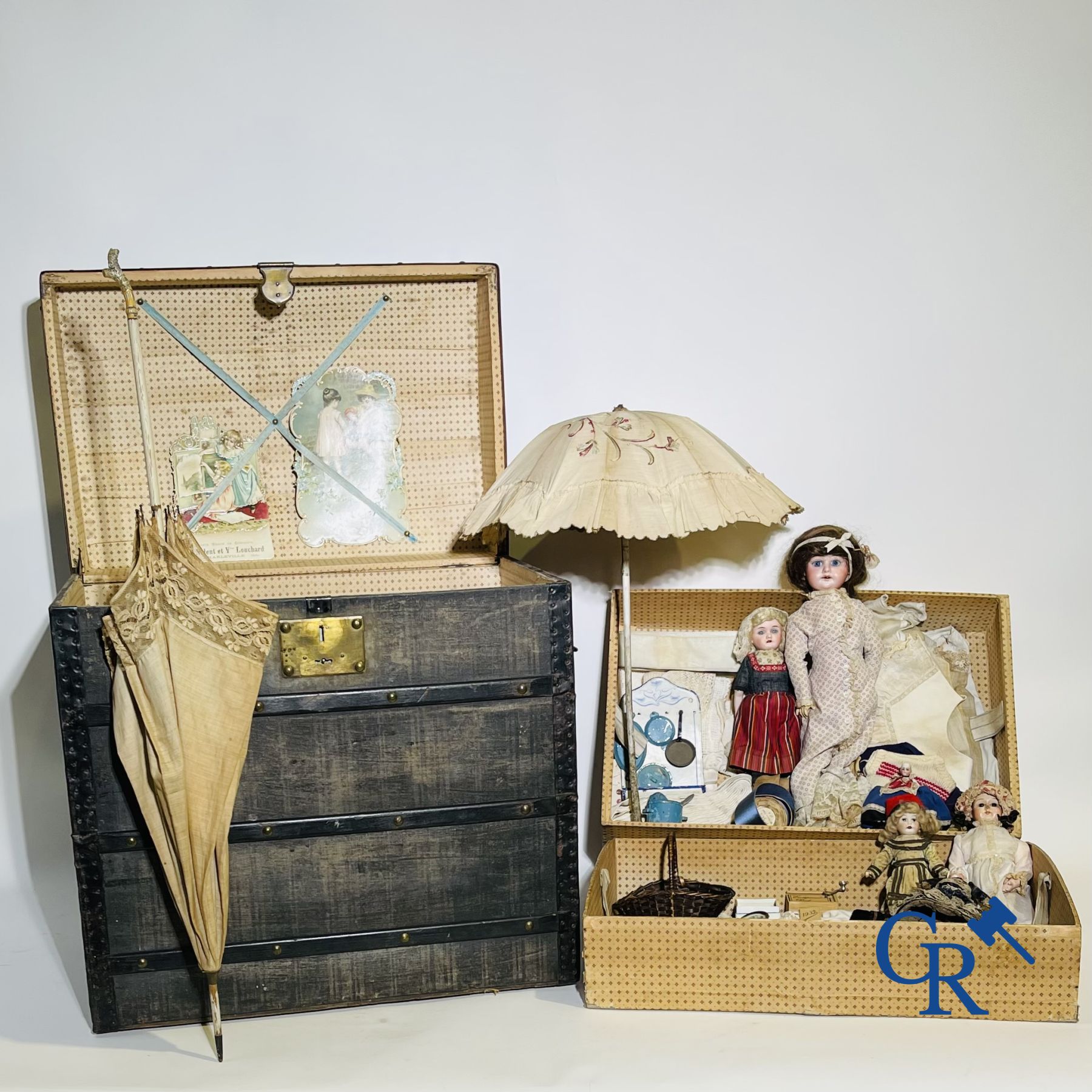 Toys: Travel case filled with various dolls and collectibles.