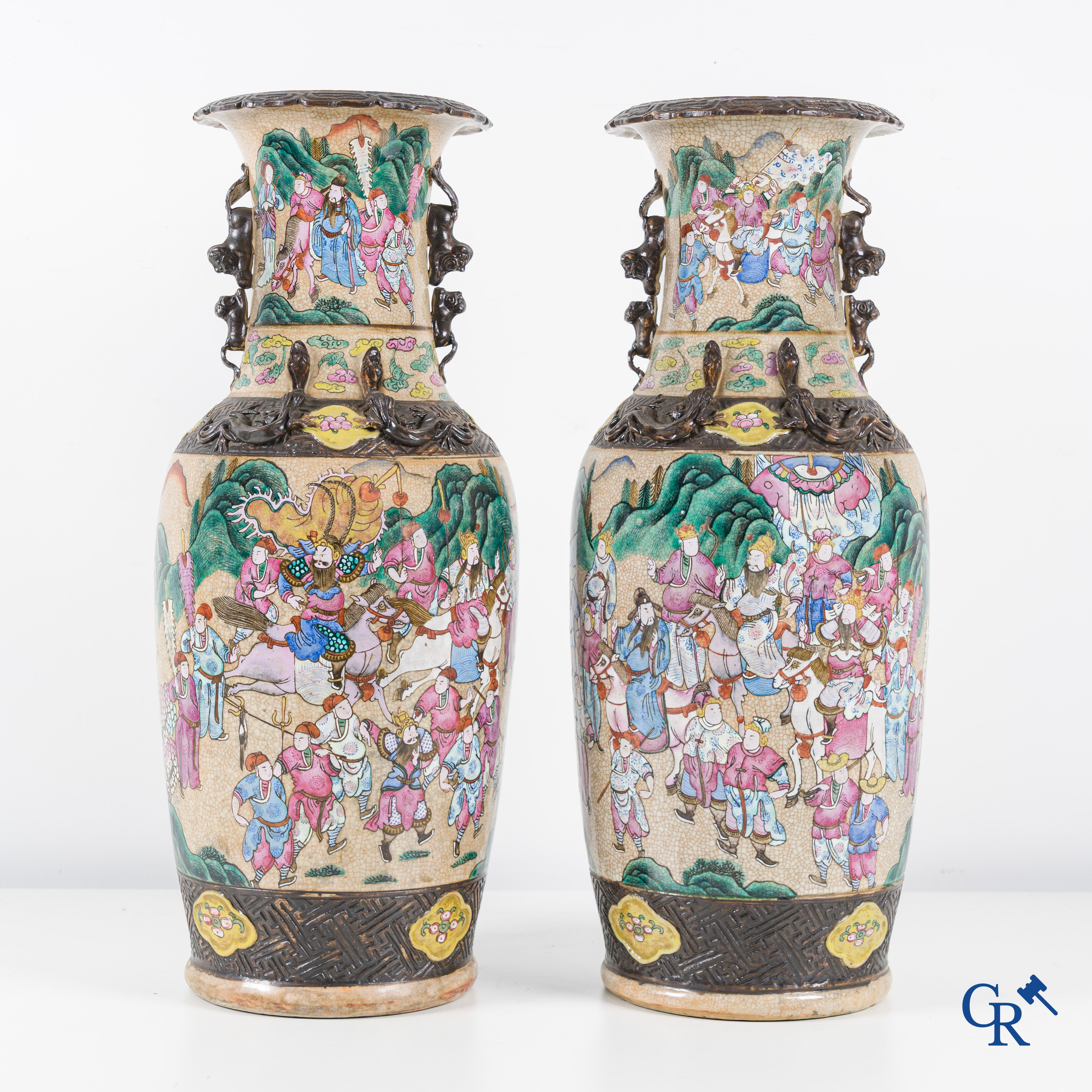 Asian Art, Chinese porcelain, a pair of Nanking vases with a scene of warriors.