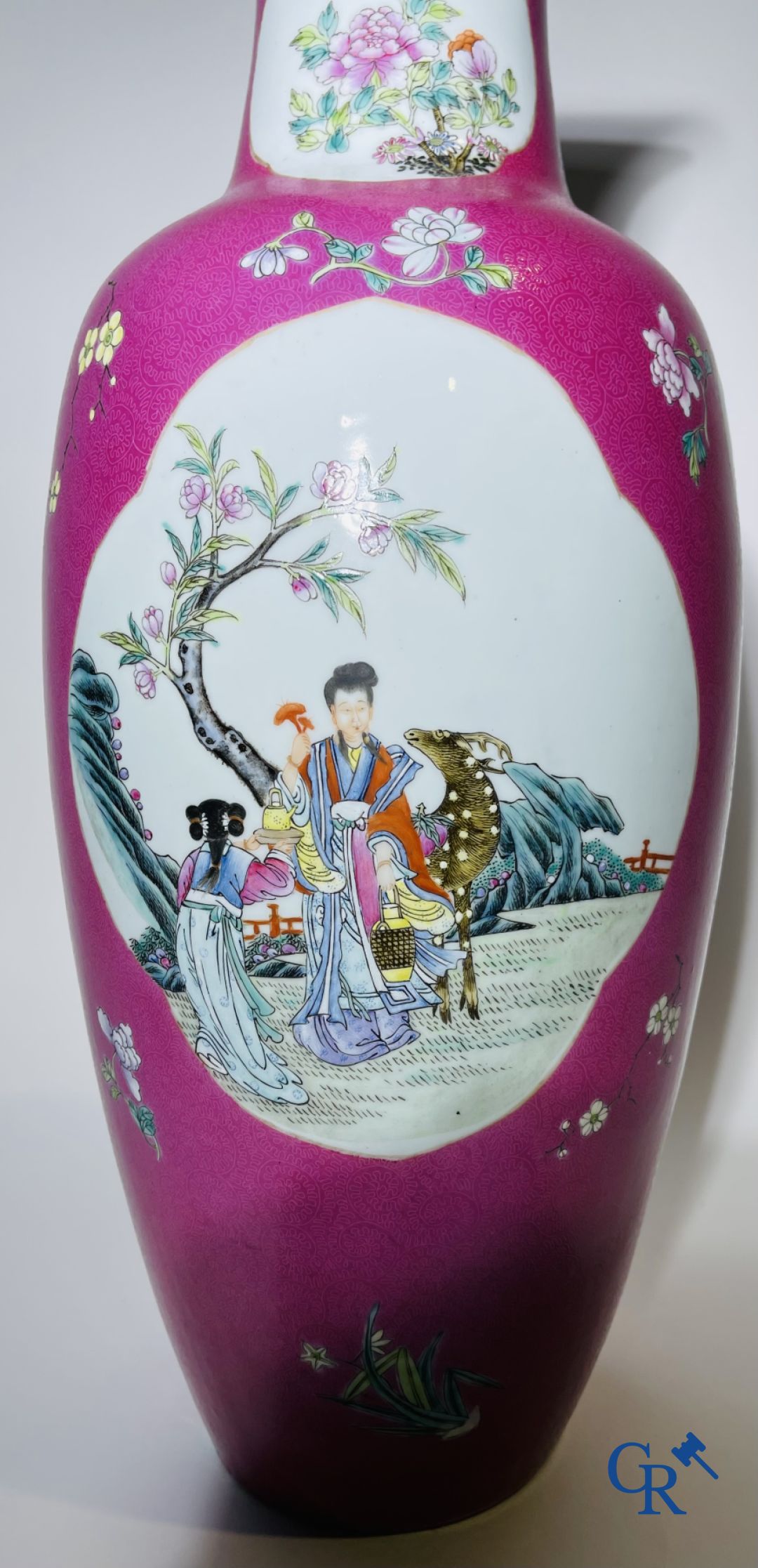 Chinese porcelain: A fine famille rose vase decorated on a red ruby background in sgraffito technique.