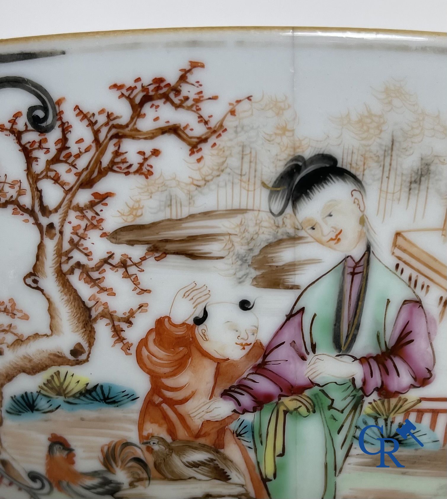 Un grand bol chinois decor mandarin en famille rose, une tasse et soucoupe en famille rose et une figurine en blanc de chine.