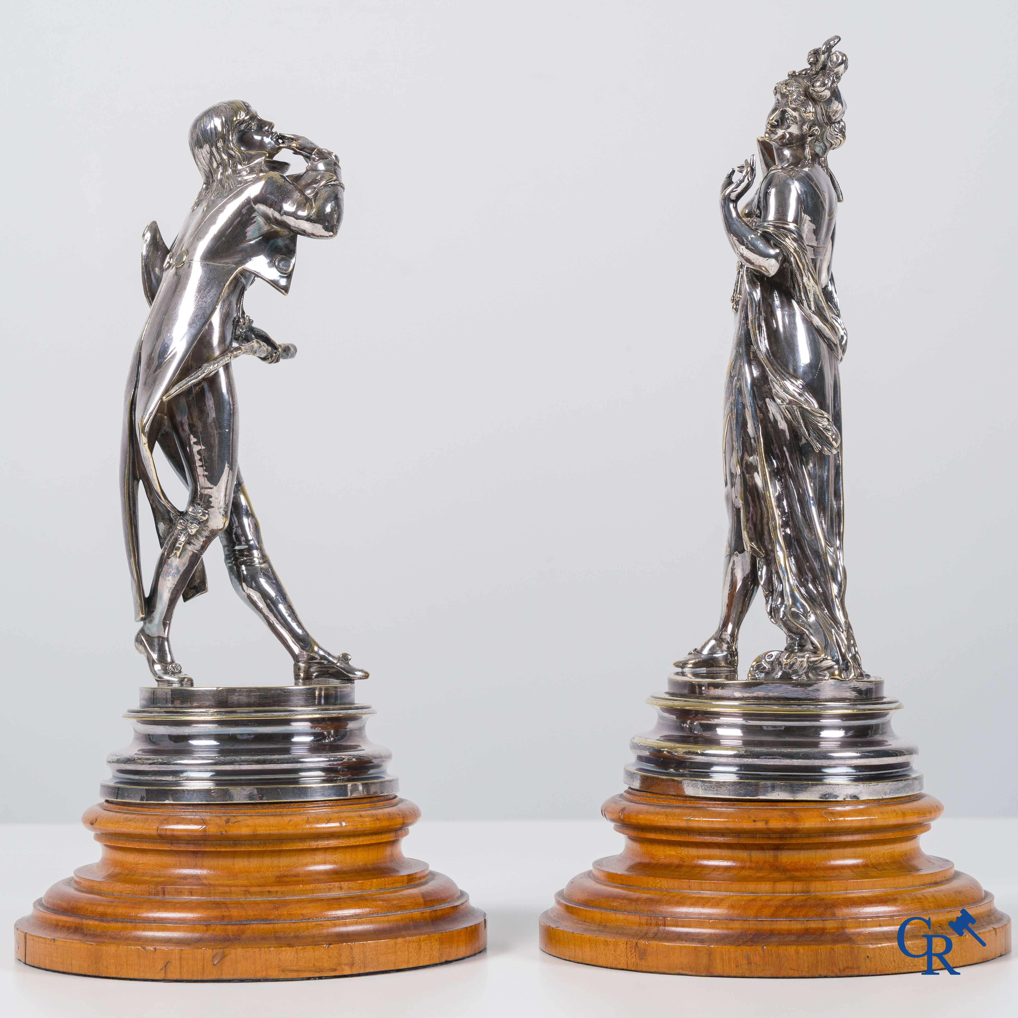 Auguste Lalouette (1826-1883) Les Incroyables/Merveilleuses. A pair of silvered bronze statues.