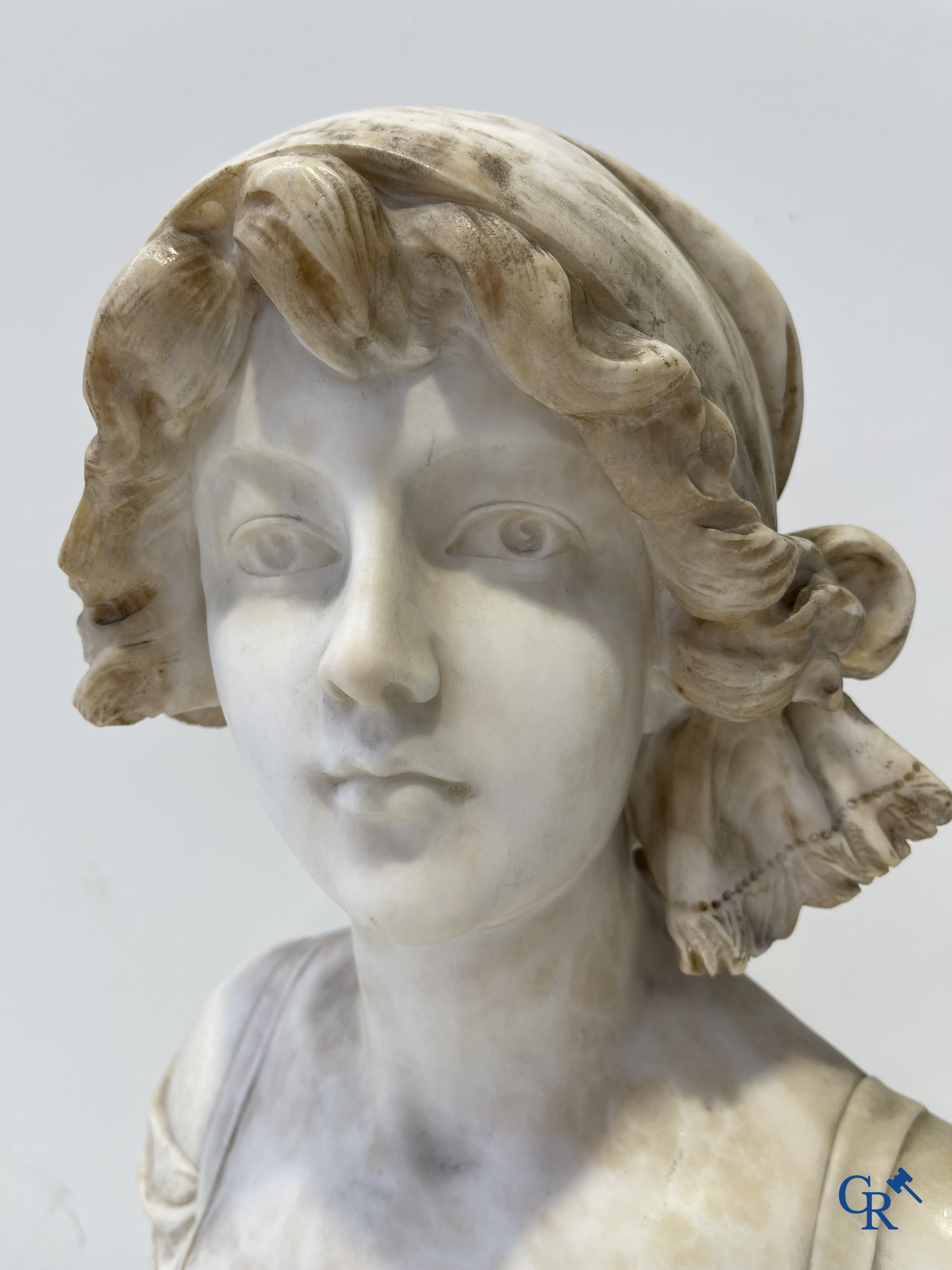 A. Cipriani. An imposing bust in marble on a green veined marble pedestal. Art Deco period.