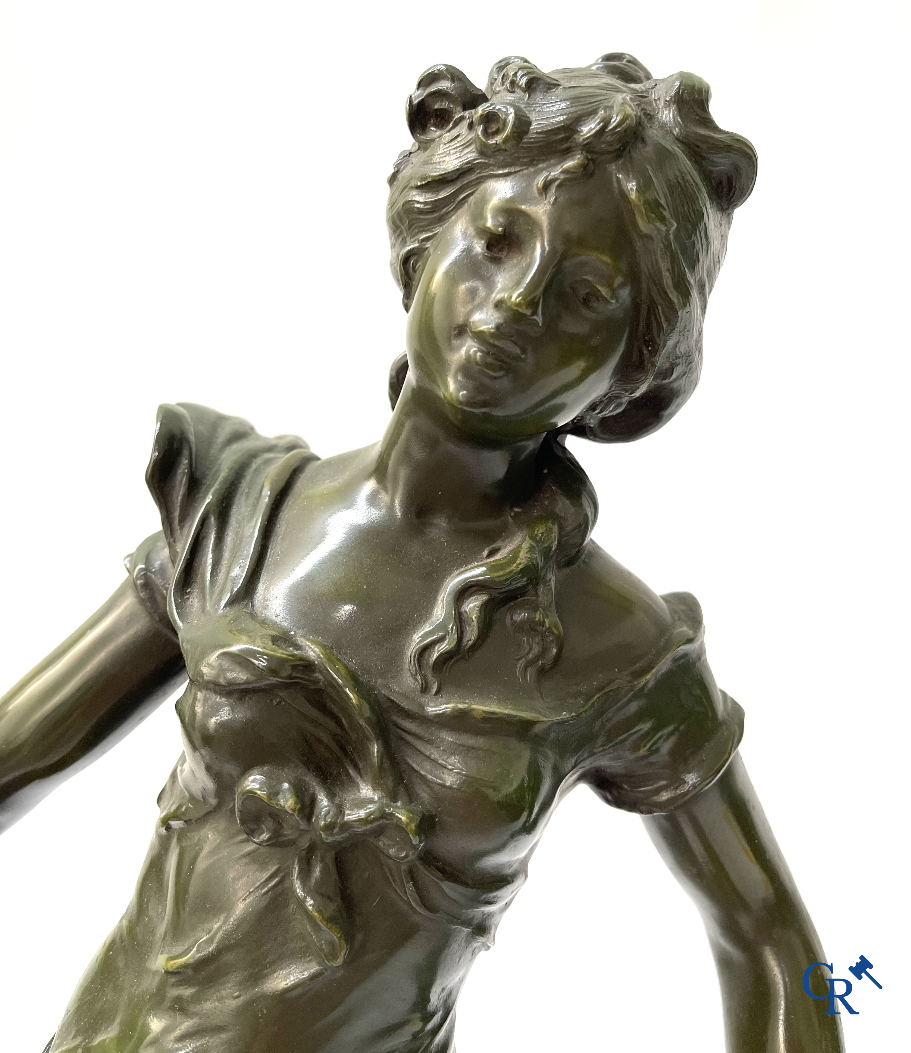 Louis & François Moreau, A large pair of statues in green patinated spelter on a wooden base. Signed L&F Moreau.