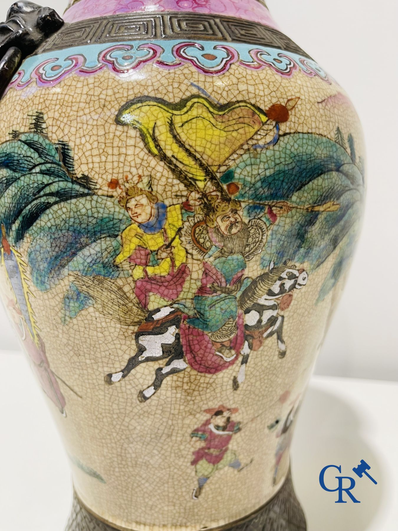 Asian art: A Chinese Nanking famille rose crackle vase with warrior decor. 19th century.