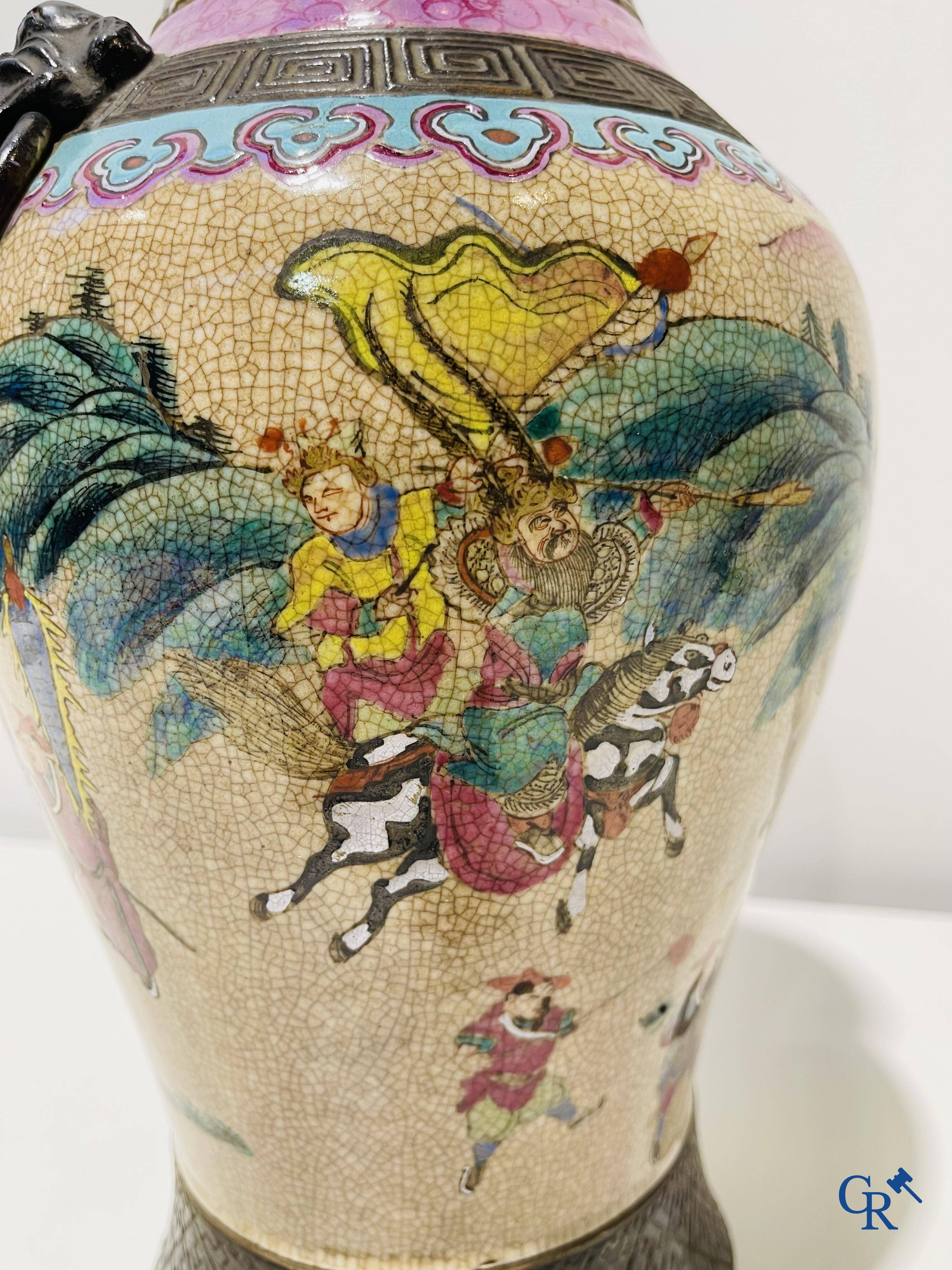 Asian art: A Chinese Nanking famille rose crackle vase with warrior decor. 19th century.