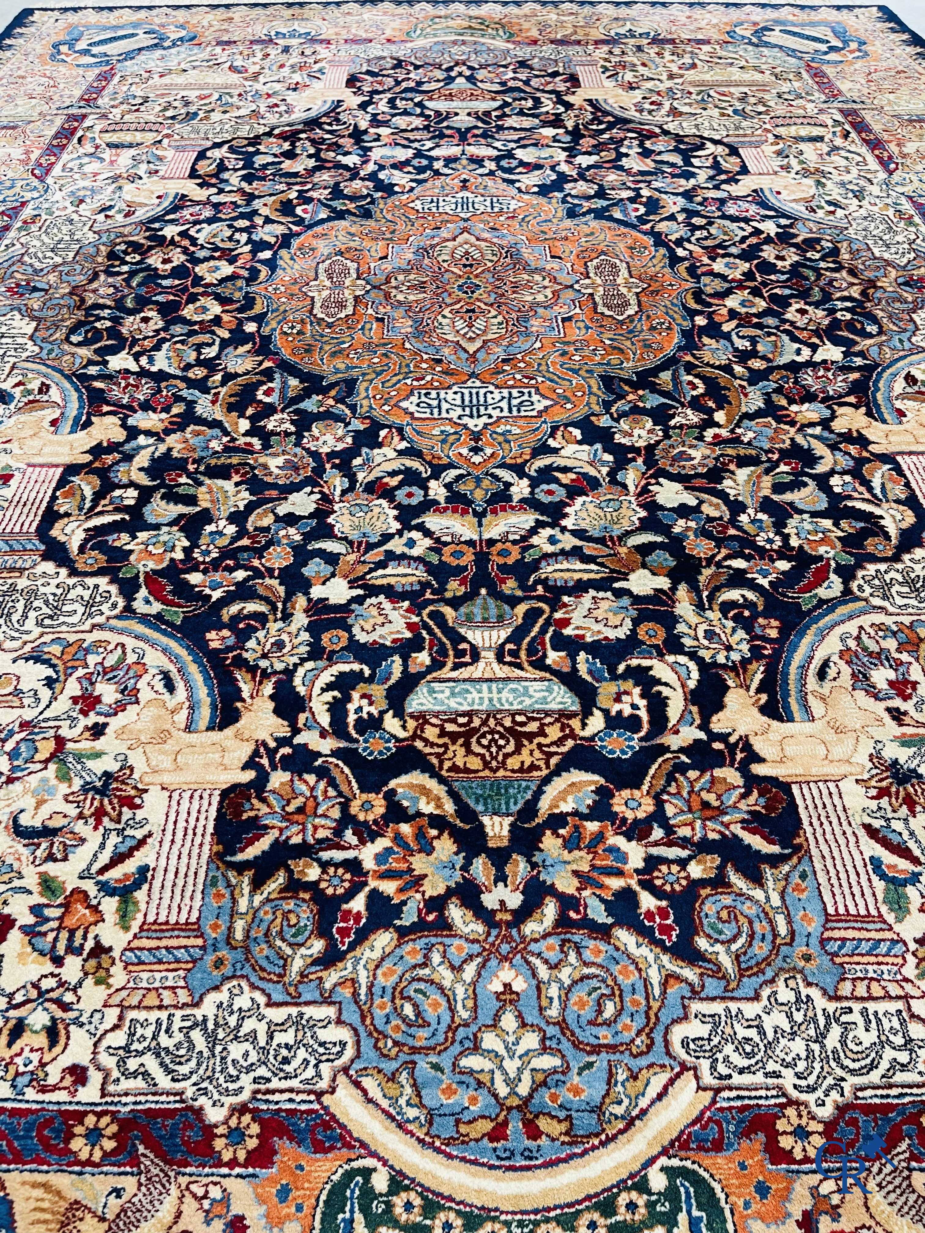 Oriental carpets: A large hand-knotted oriental carpet with antique decor. Multiple inscriptions.