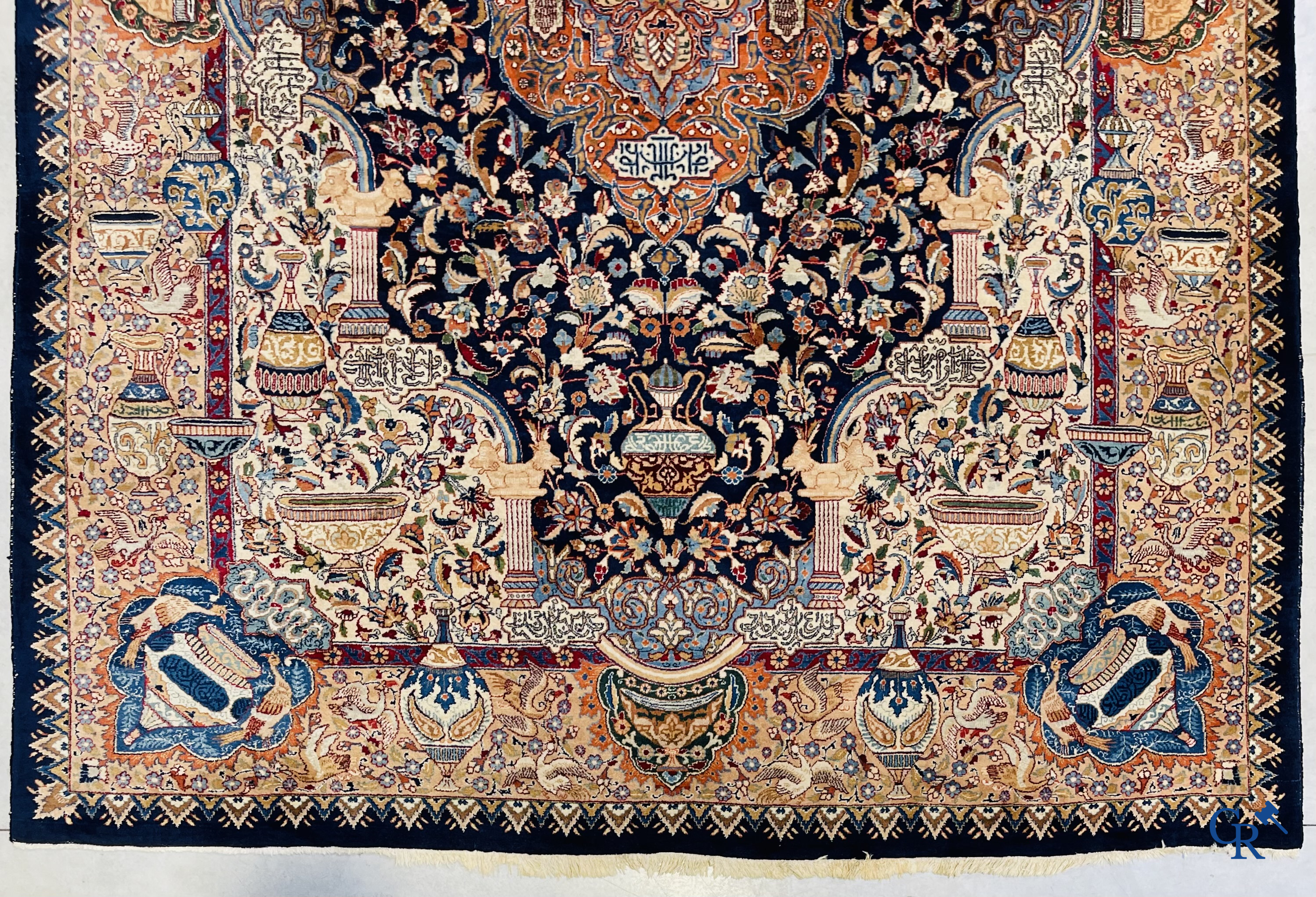 Oriental carpets: A large hand-knotted oriental carpet with antique decor. Multiple inscriptions.