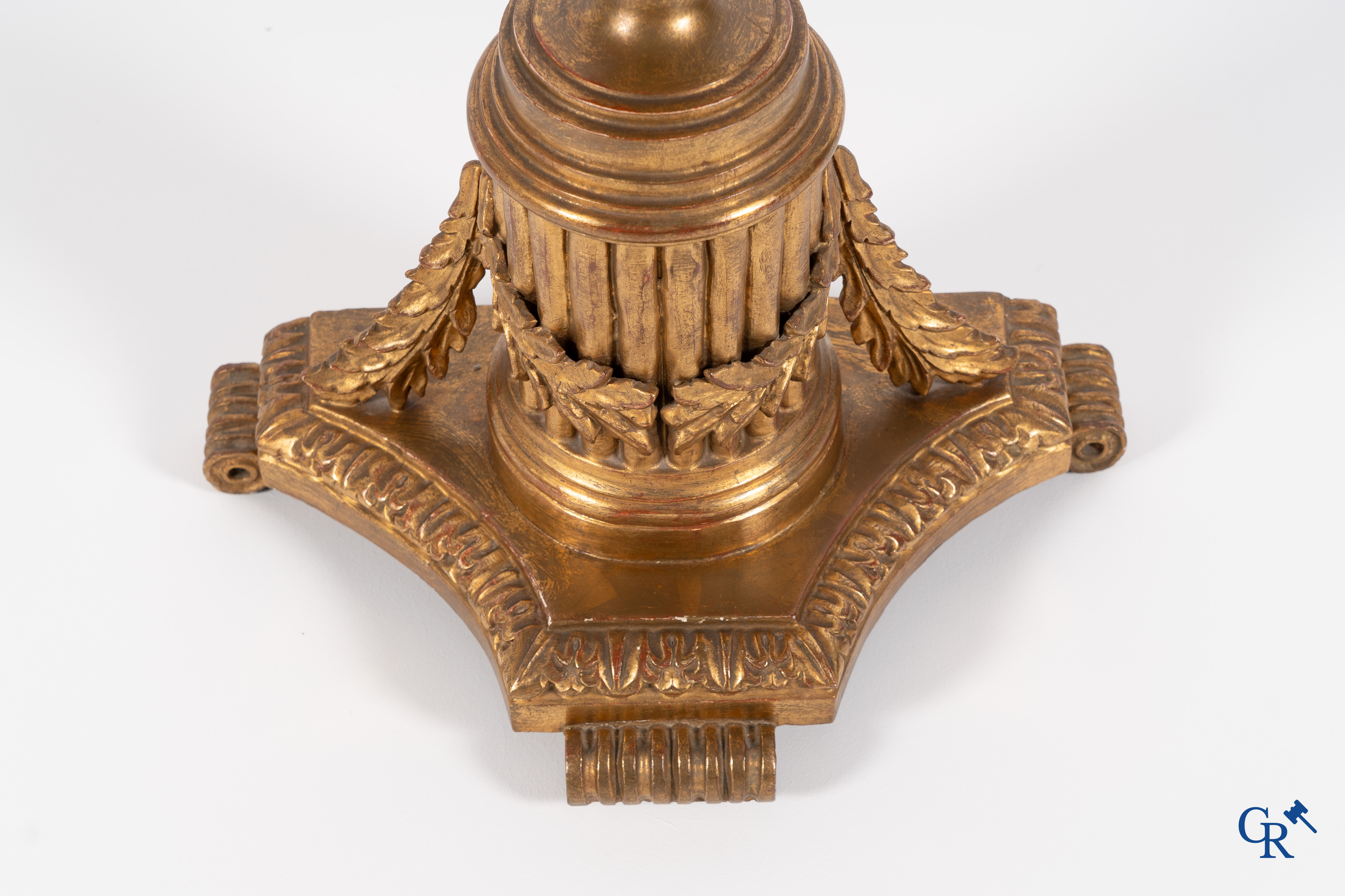 A wood-carved and gilded wall console.