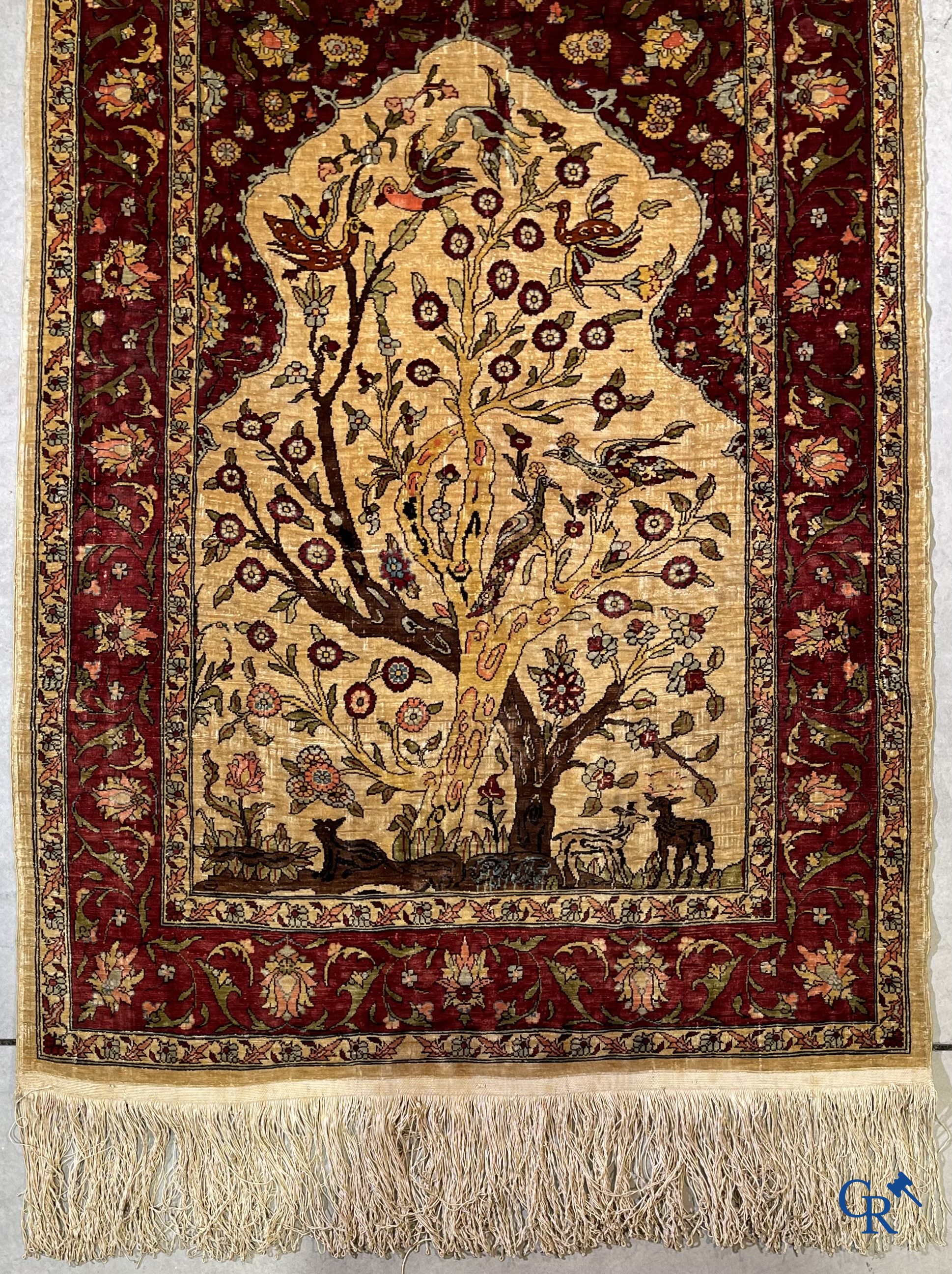 Oriental carpets, Hereke, a finely hand-knotted and signed silk carpet with a tree of life.