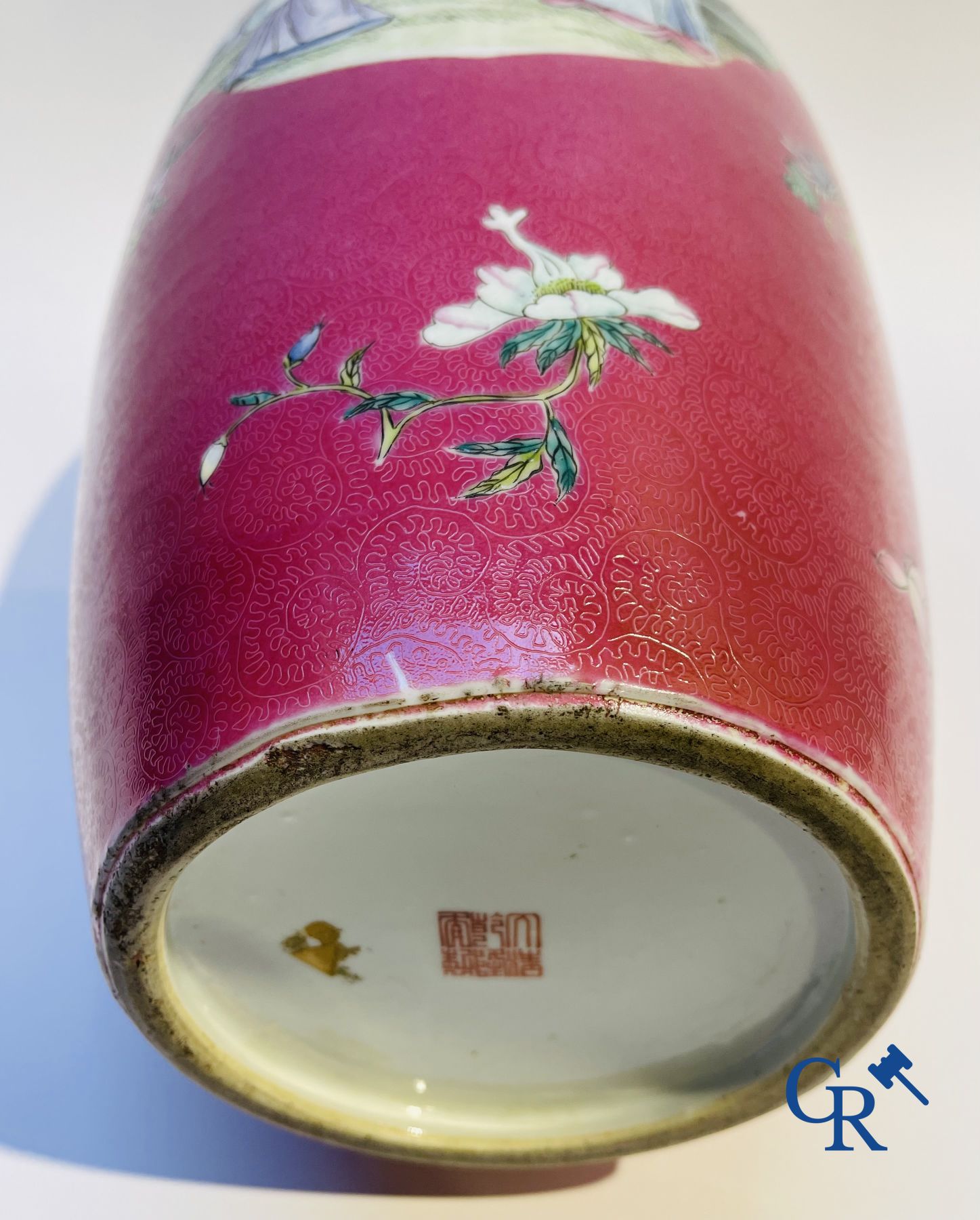 Chinese porcelain: A fine famille rose vase decorated on a red ruby background in sgraffito technique.