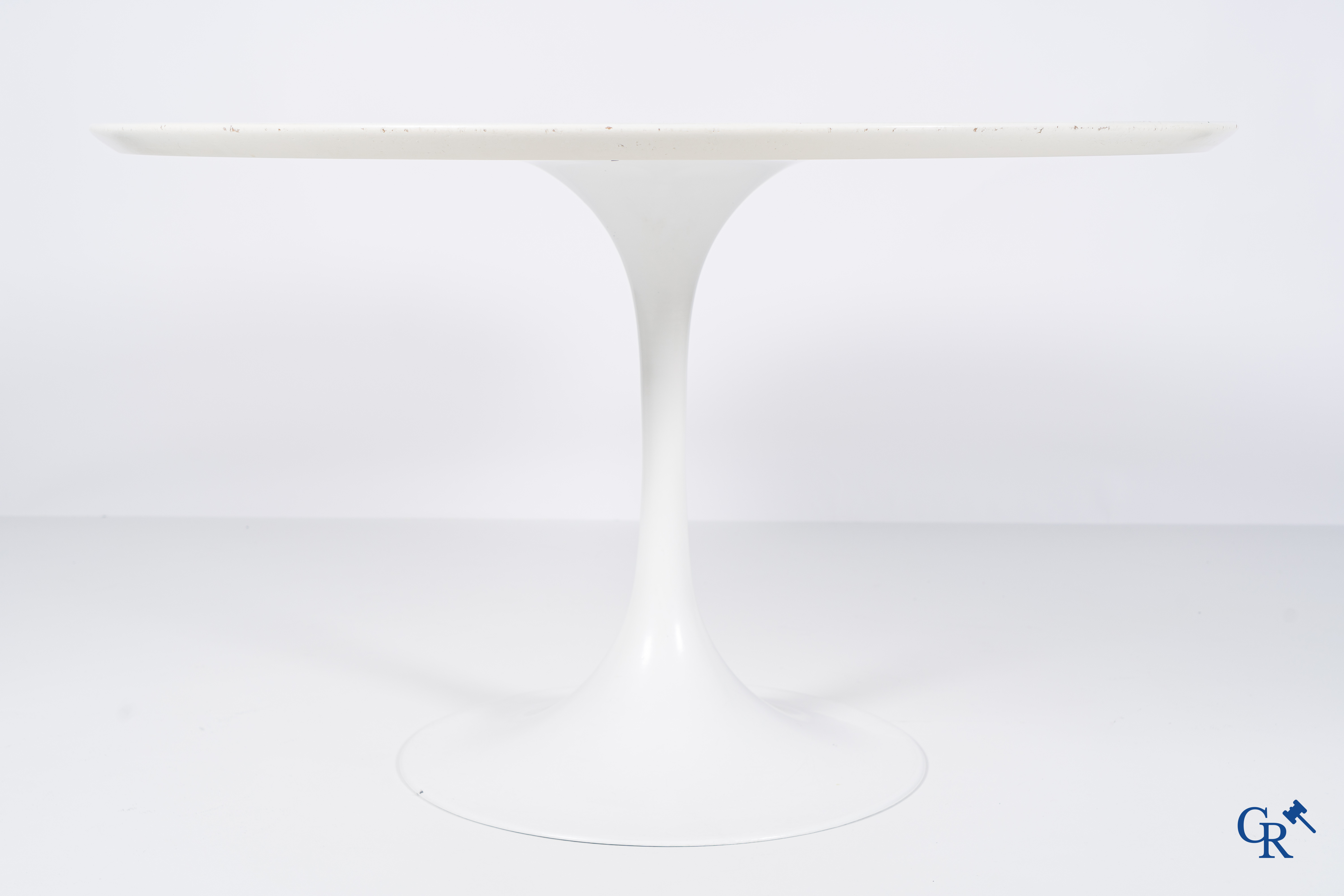 Design table with 4 chairs in the manner of Eero Saarinen, circa 1980.