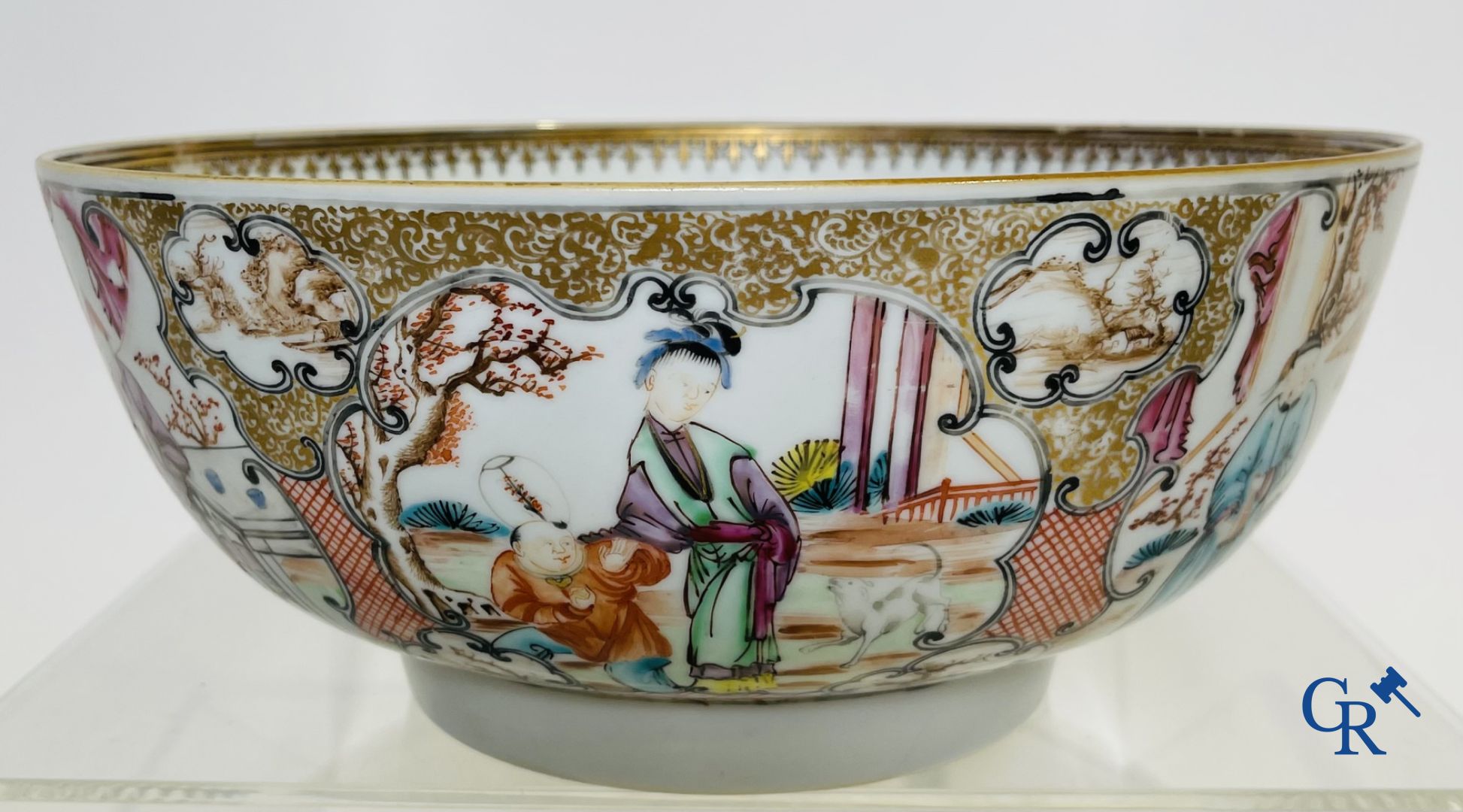 A large Chinese famille rose mandarin bowl, a famille rose cup and saucer and a figurine in blanc de chine.