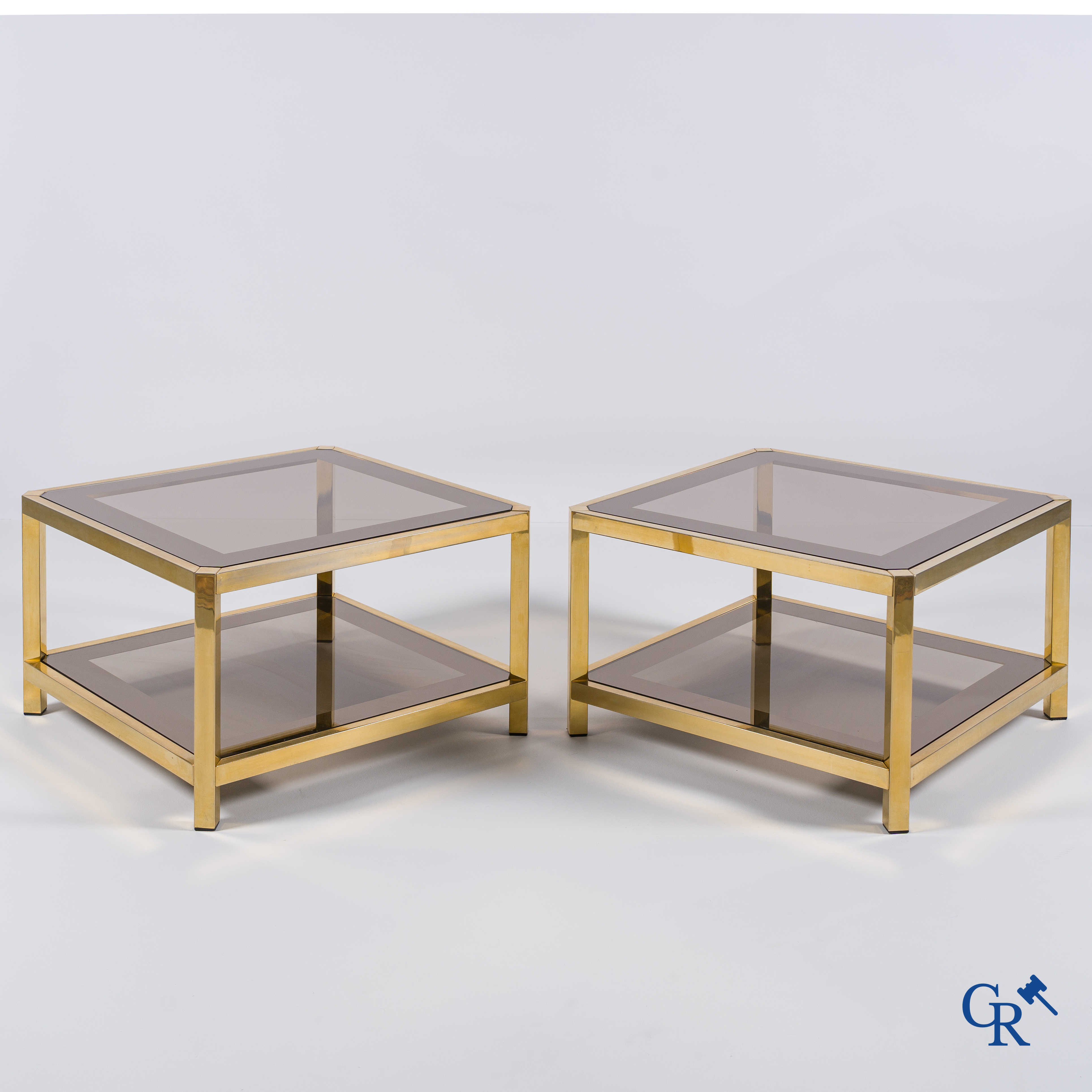 Design: Belgochrom, a pair of side tables (bouts de canapé) in gold-plated brass and glass, circa 1980.