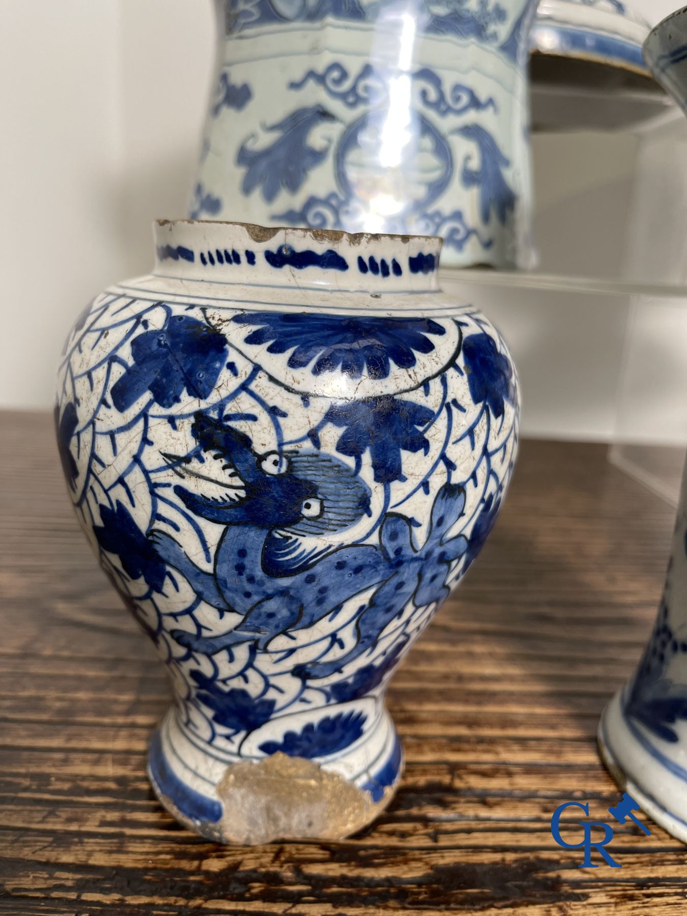 Delft: 11 pieces of blue and white faience with different décors. 17th - 18th century.