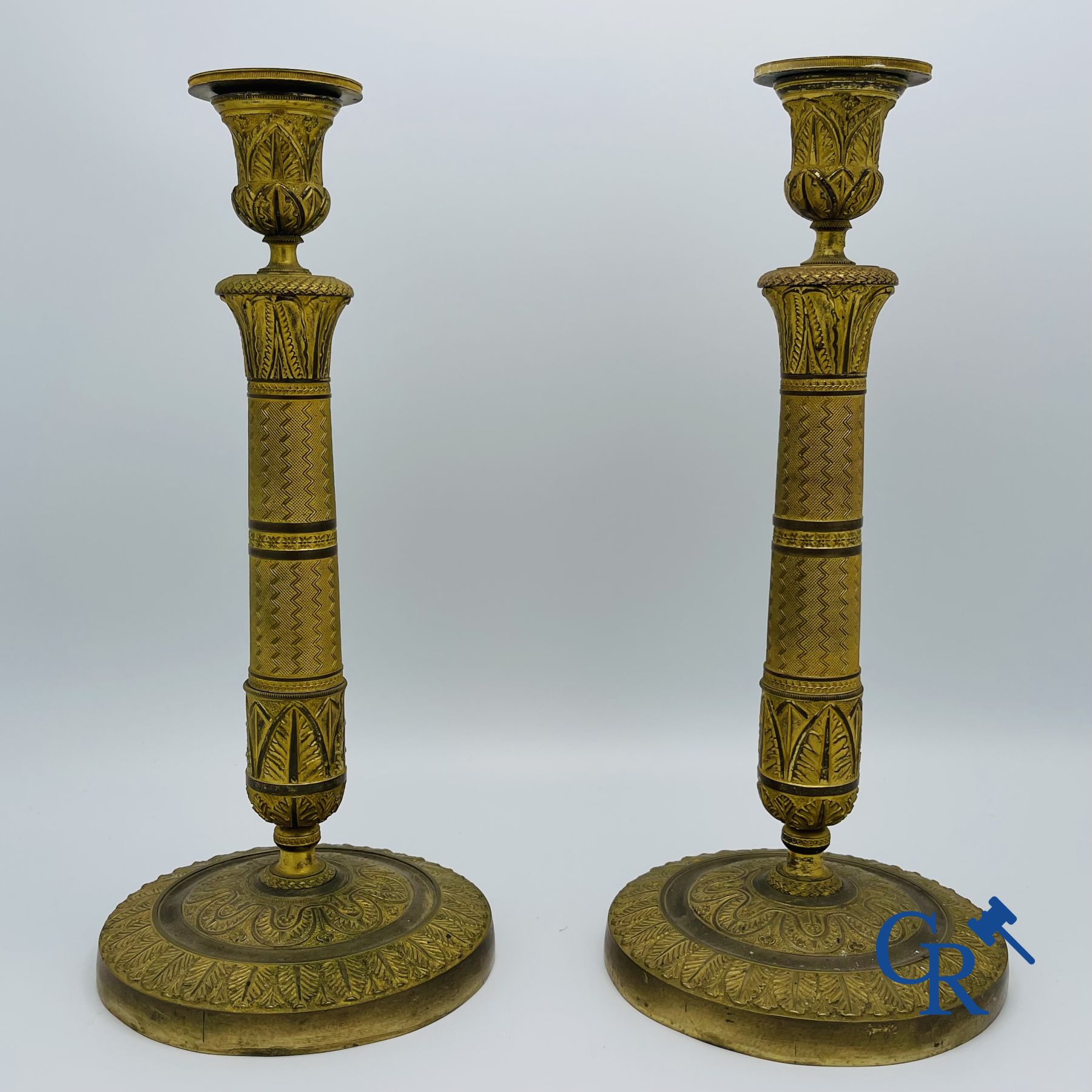 Pair of Charles X candlesticks in gilded bronze.