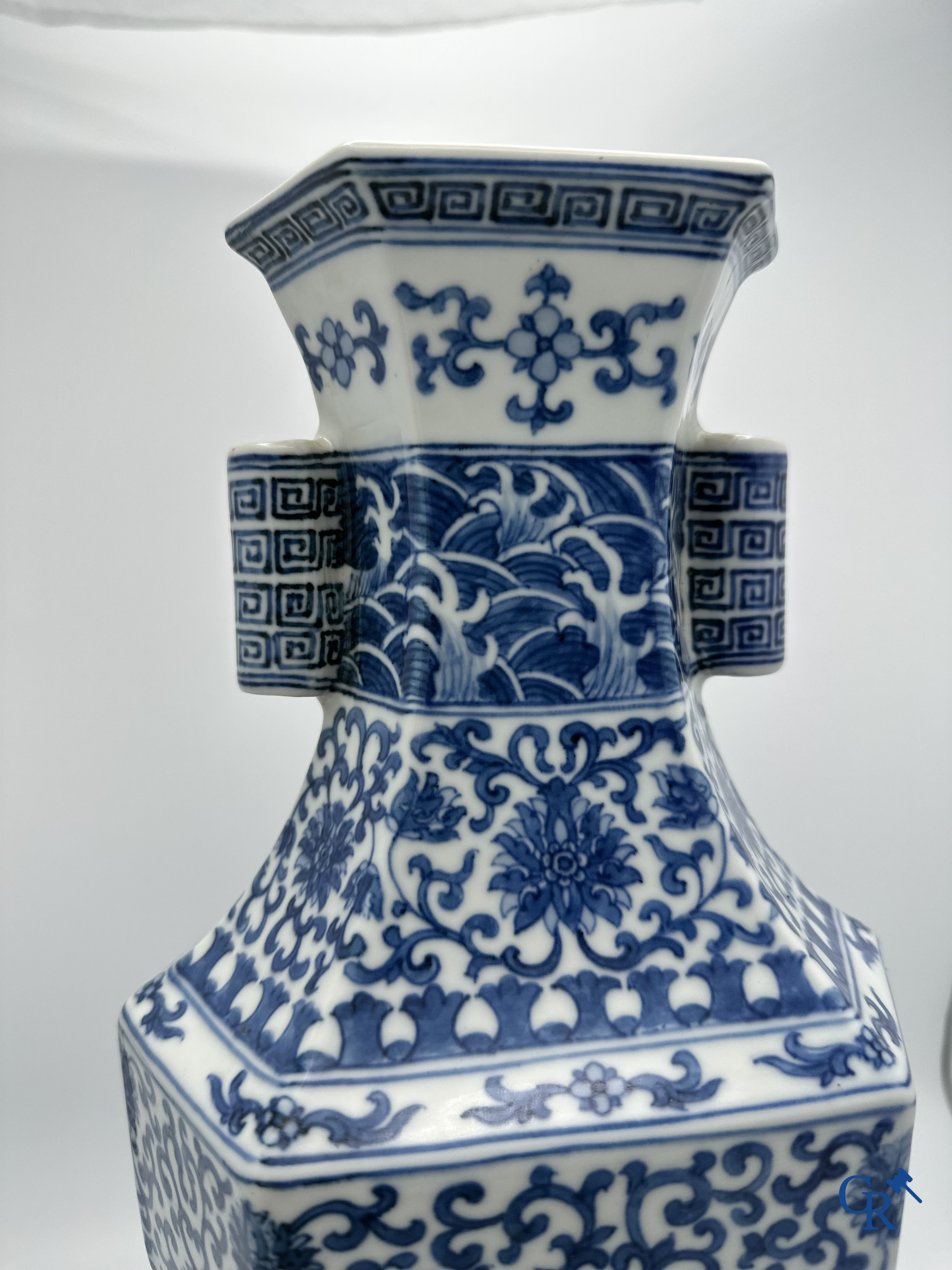 Chinese porcelain: Chinese blue and white vase with floral decor.